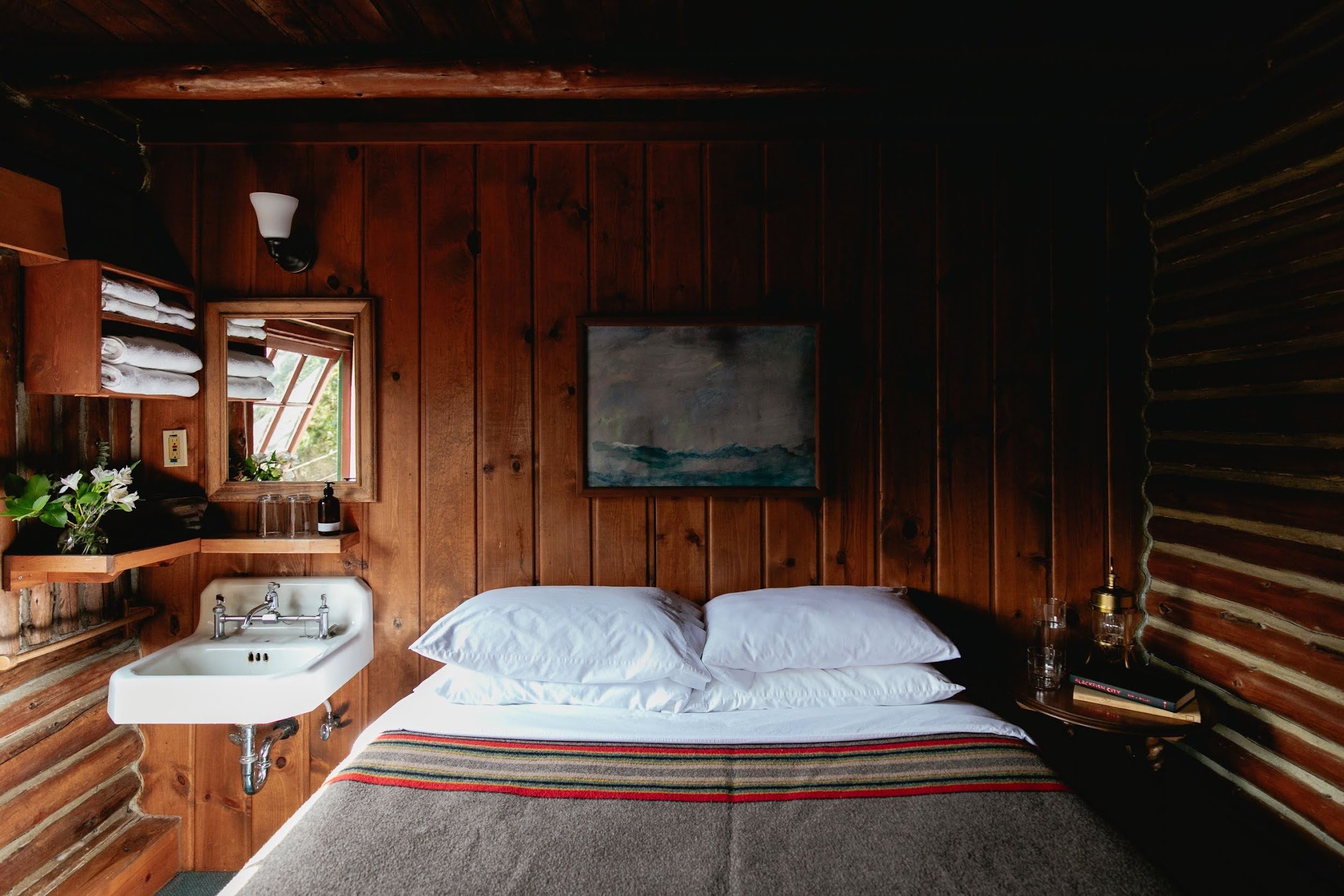 Historic log-walled guest room at Captain Whidbey