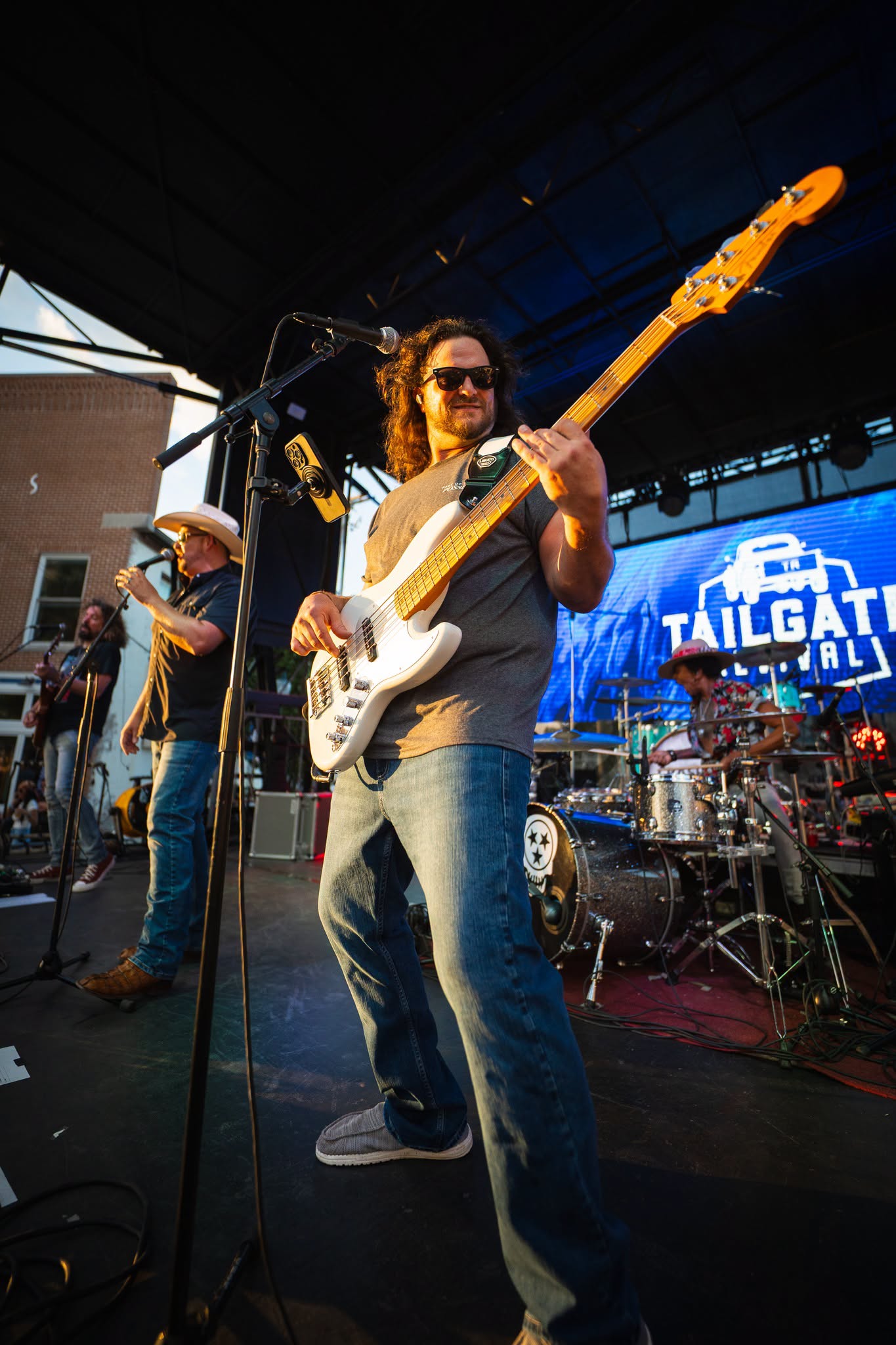 Tailgate Revival bassist playing an outdoor show