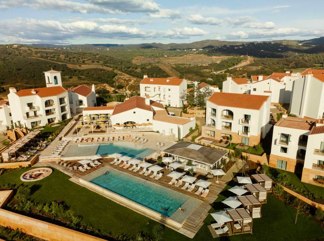 Viceroy at Ombria Algarve with whitewashed buildings around an outdoor pool