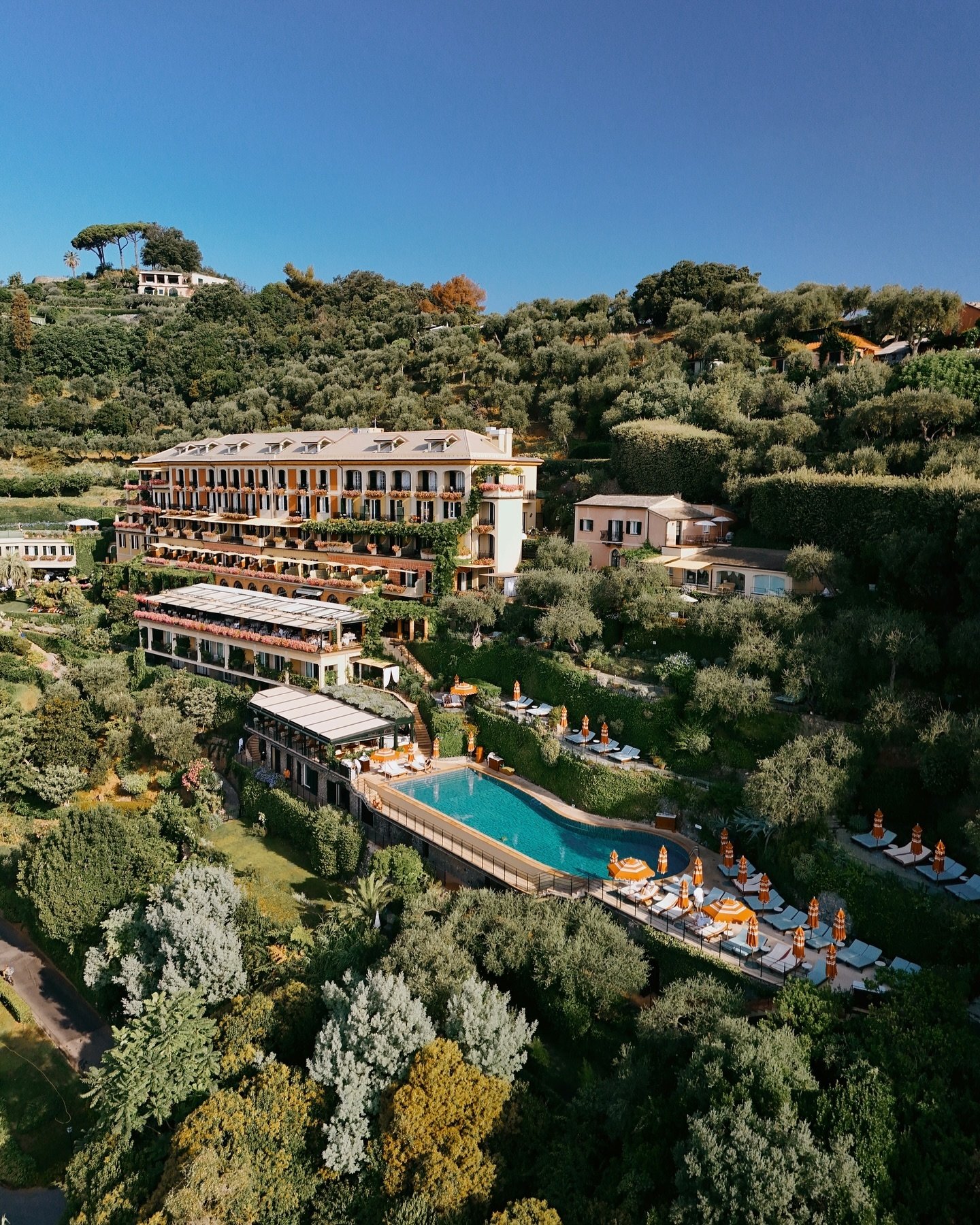 Aerial view of Splendido, its pool, gardens, and the Portofino hillside