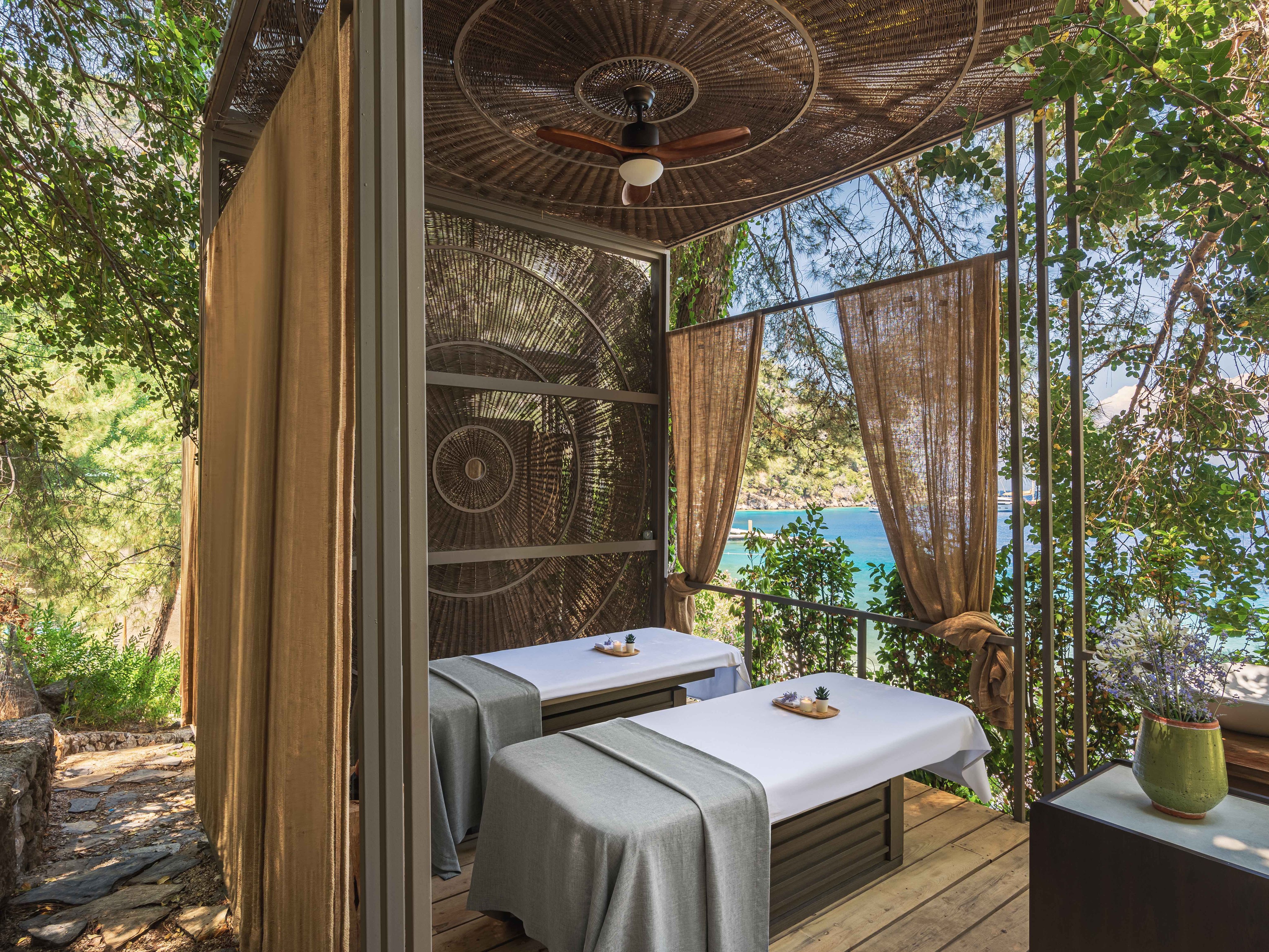 Spa treatment beds overlooking the sea at Yazz Collective