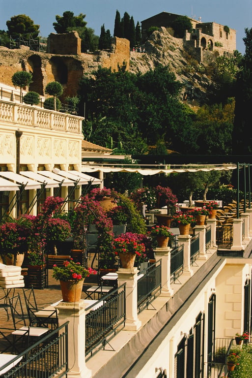 Flower-lined terraces at Grand Hotel Timeo beneath Taormina’s hillside
