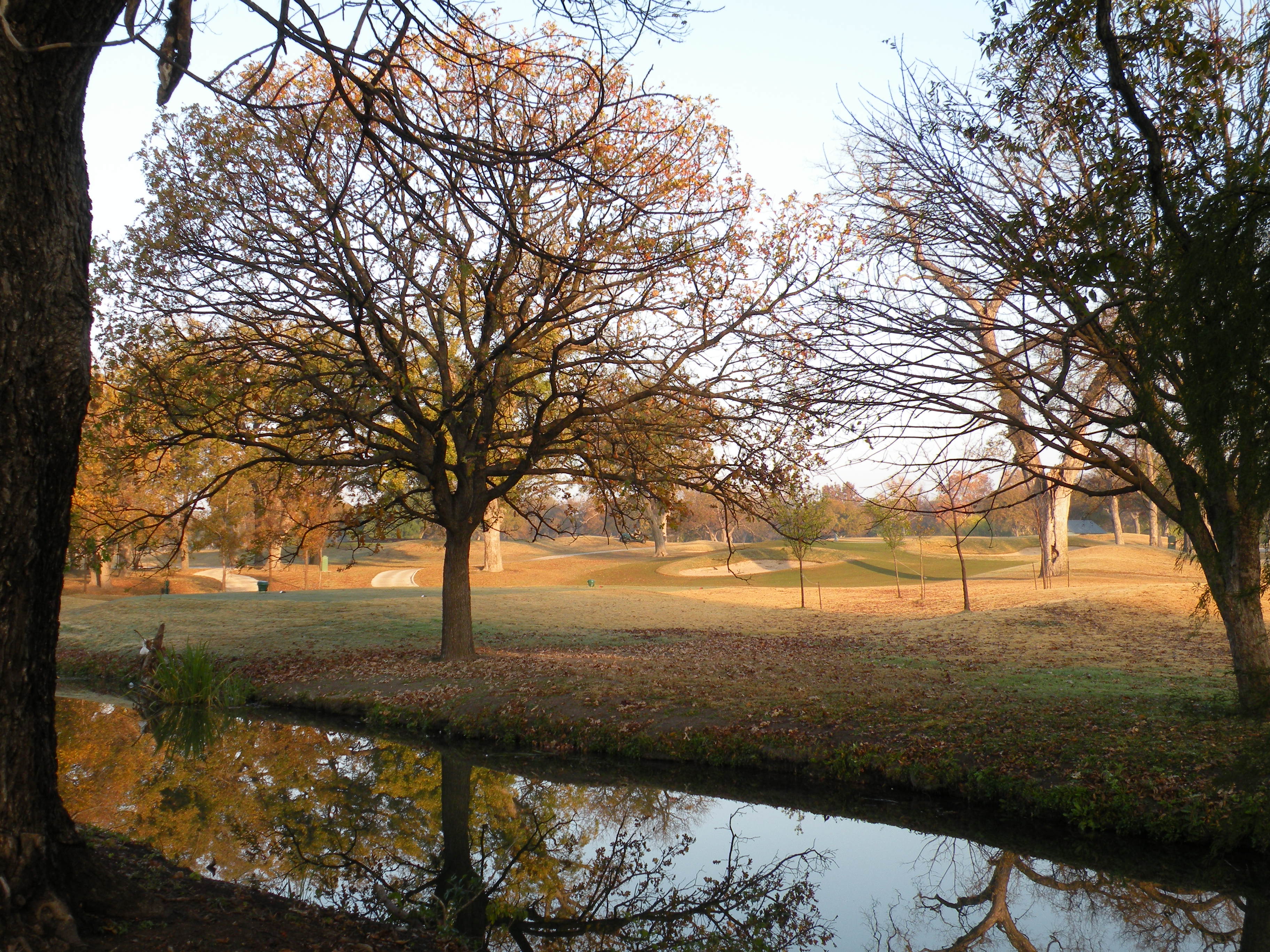 Water, bunkers and trees at Brackenridge Park Golf Course, photographed in December 2010.