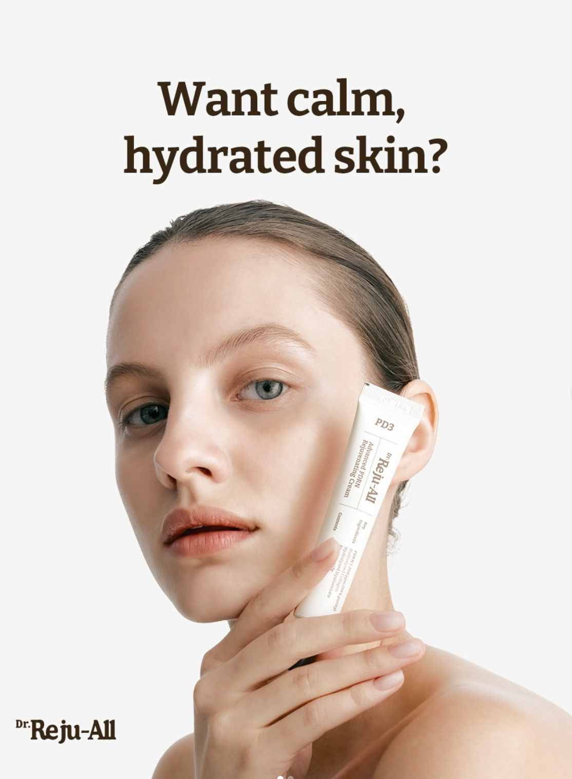Model holding Dr. Reju-All product against face