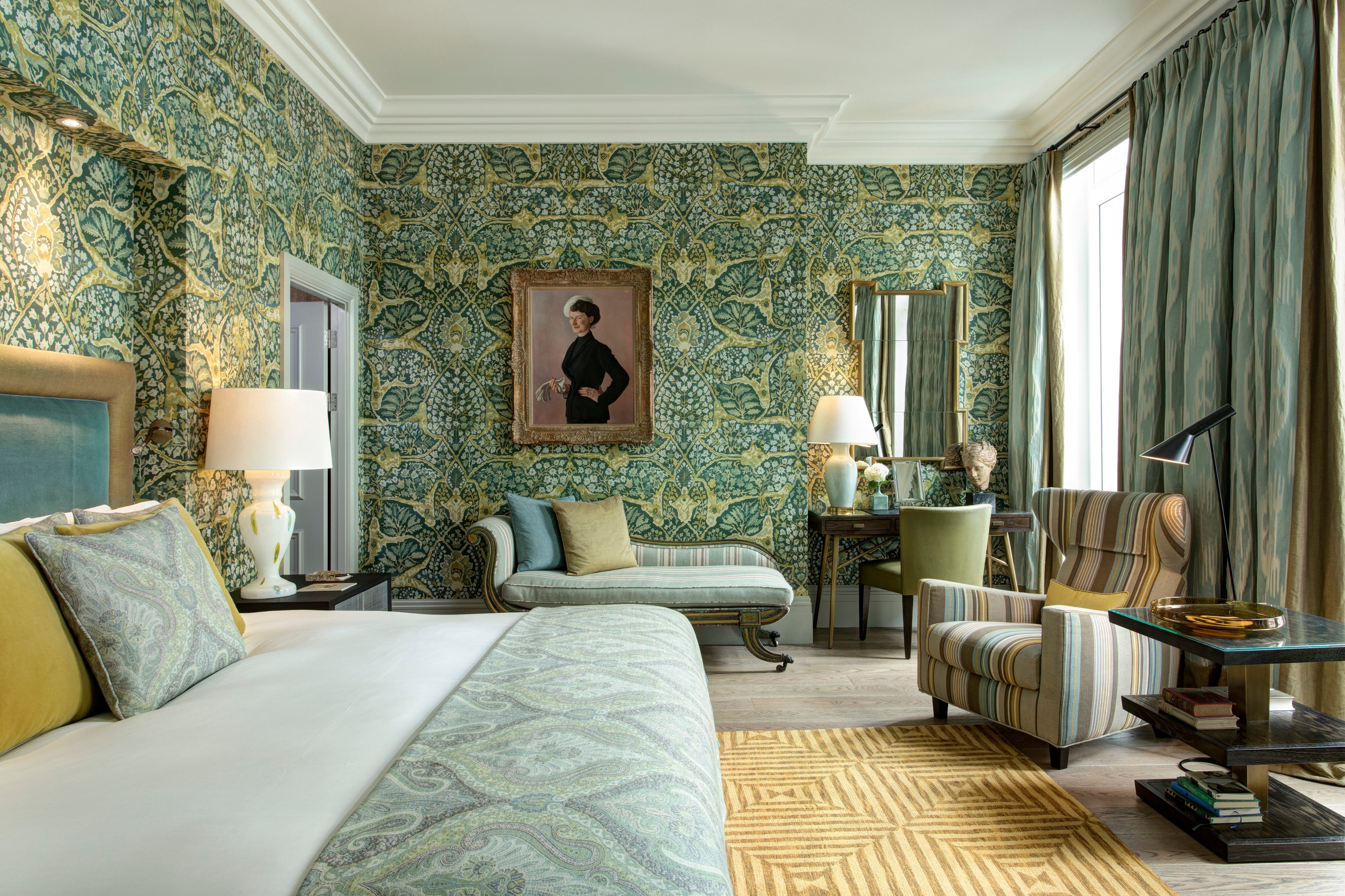 Patterned bedroom and sitting area at Brown’s Hotel