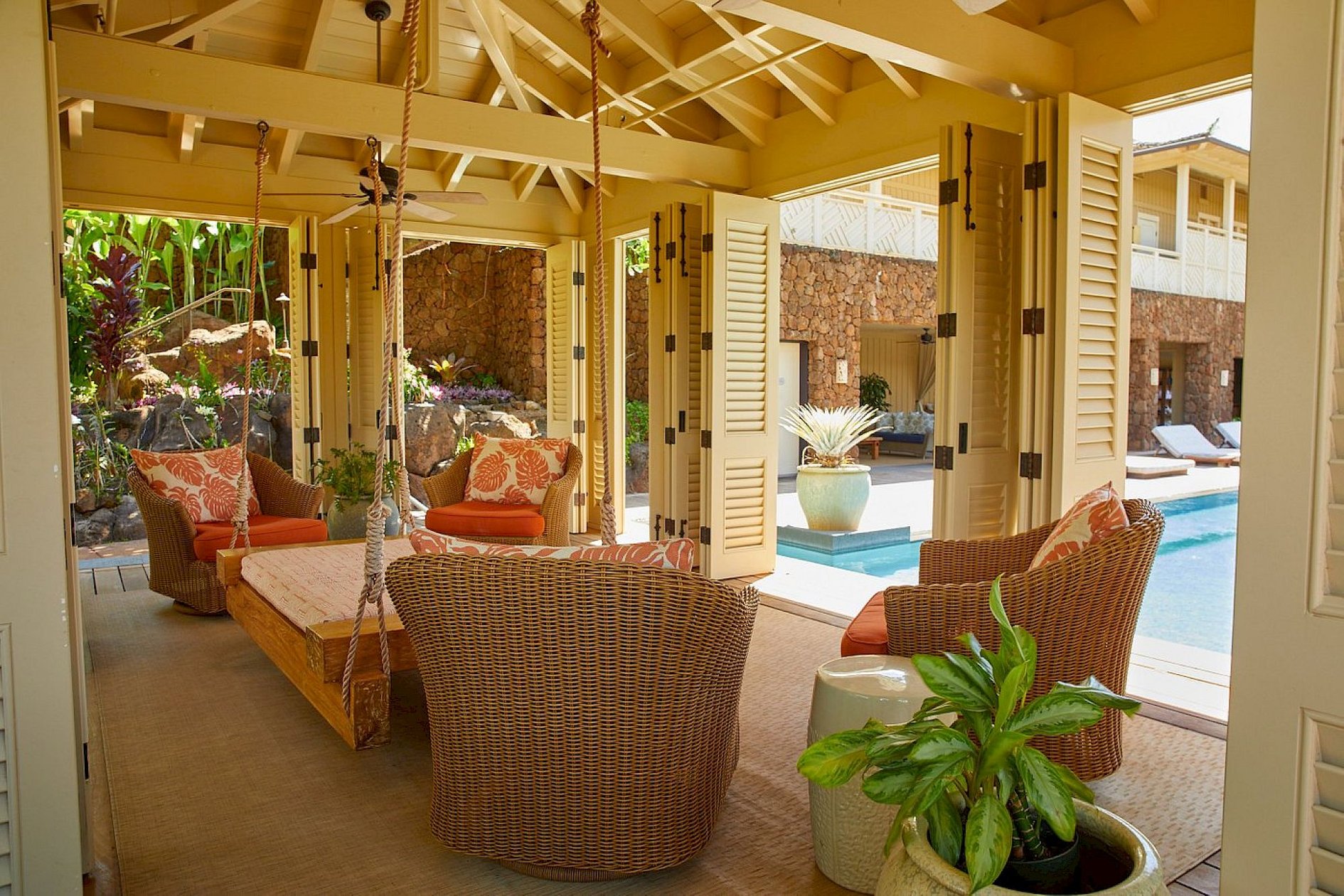 Airy lounge with vaulted timber ceilings and garden views