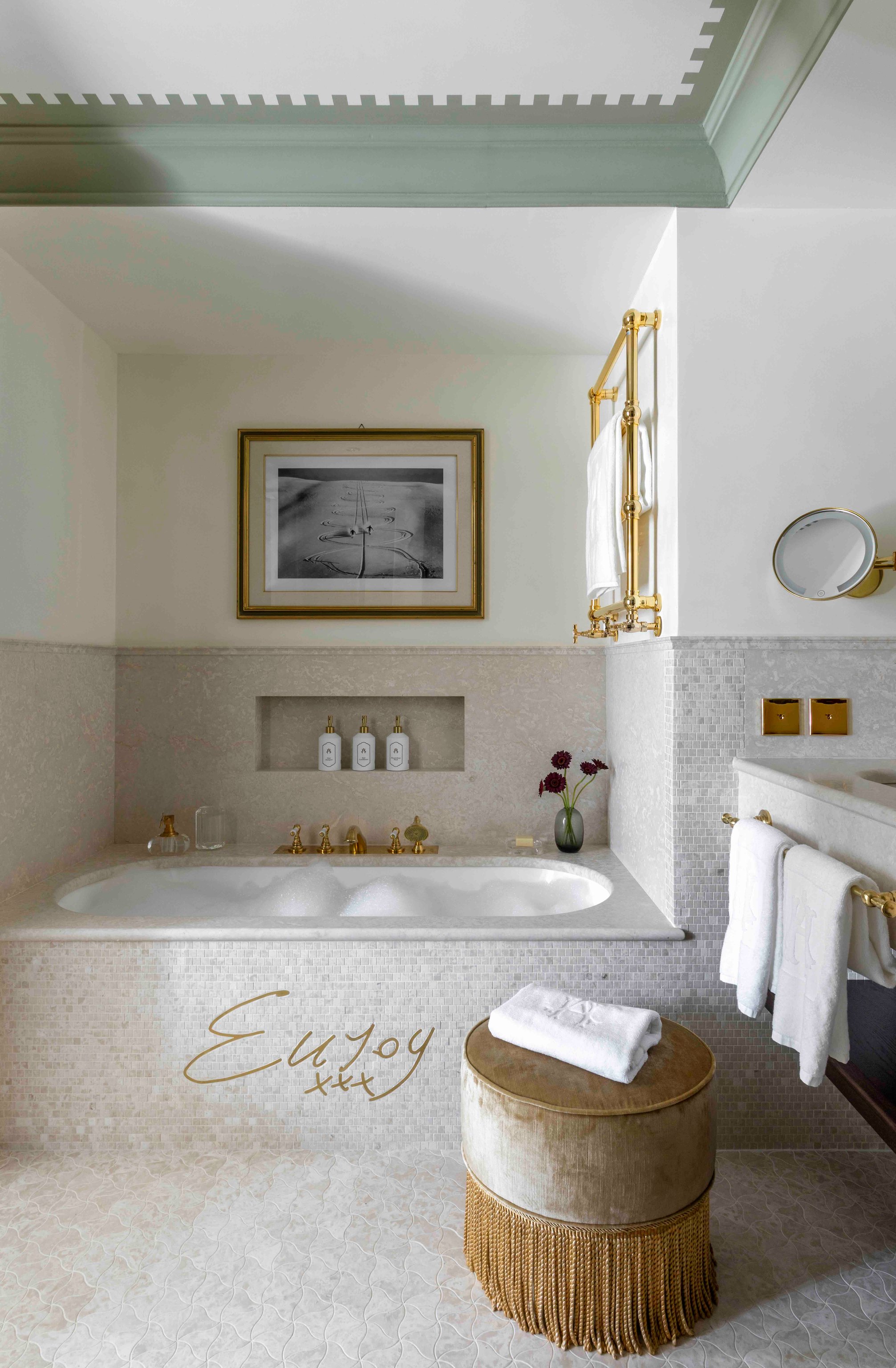 Guest bathroom with a freestanding bathtub and pale green ceiling