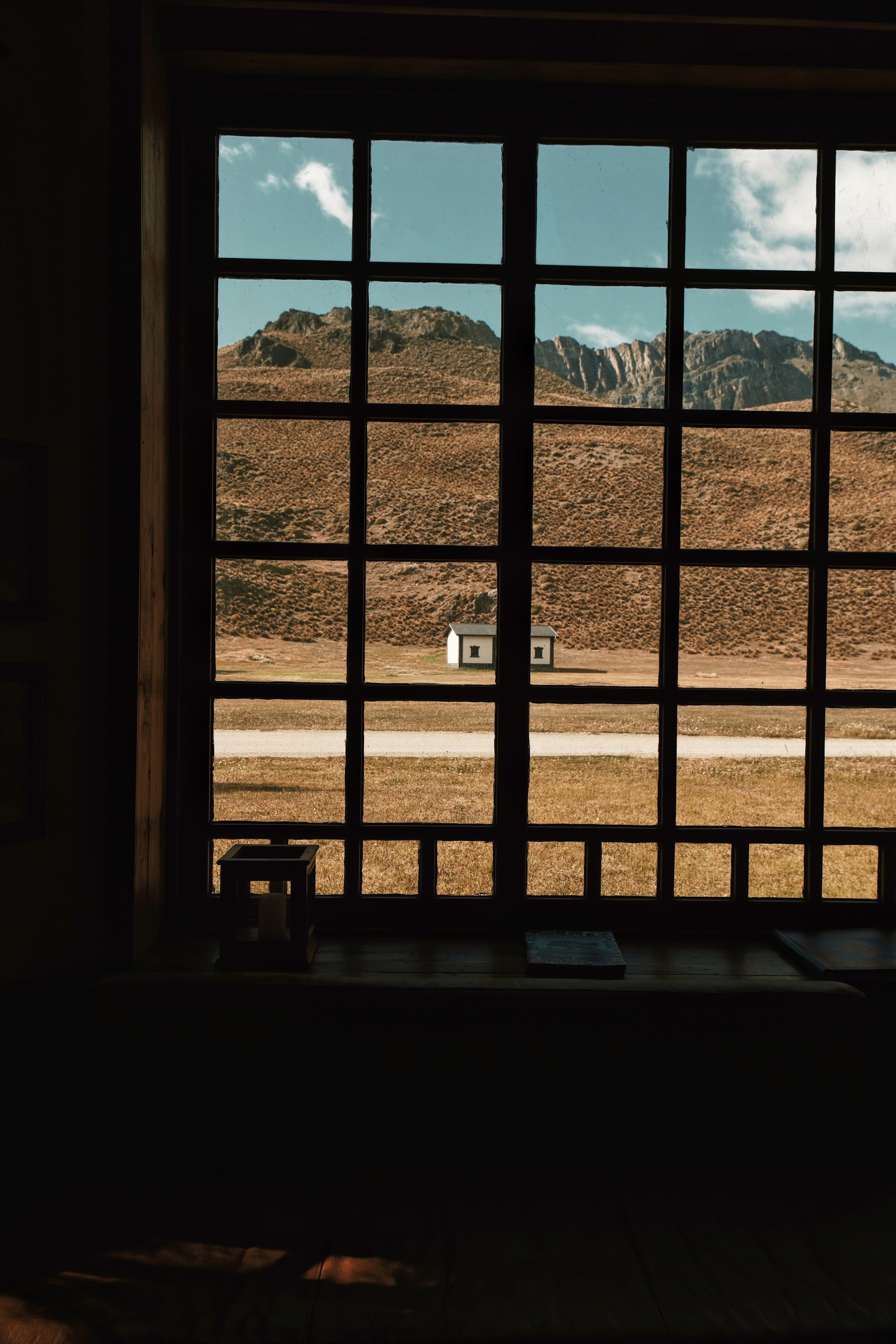 Patagonian landscape seen through a lodge window