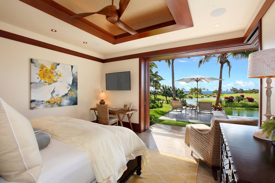 Guest bedroom opening onto a tropical garden