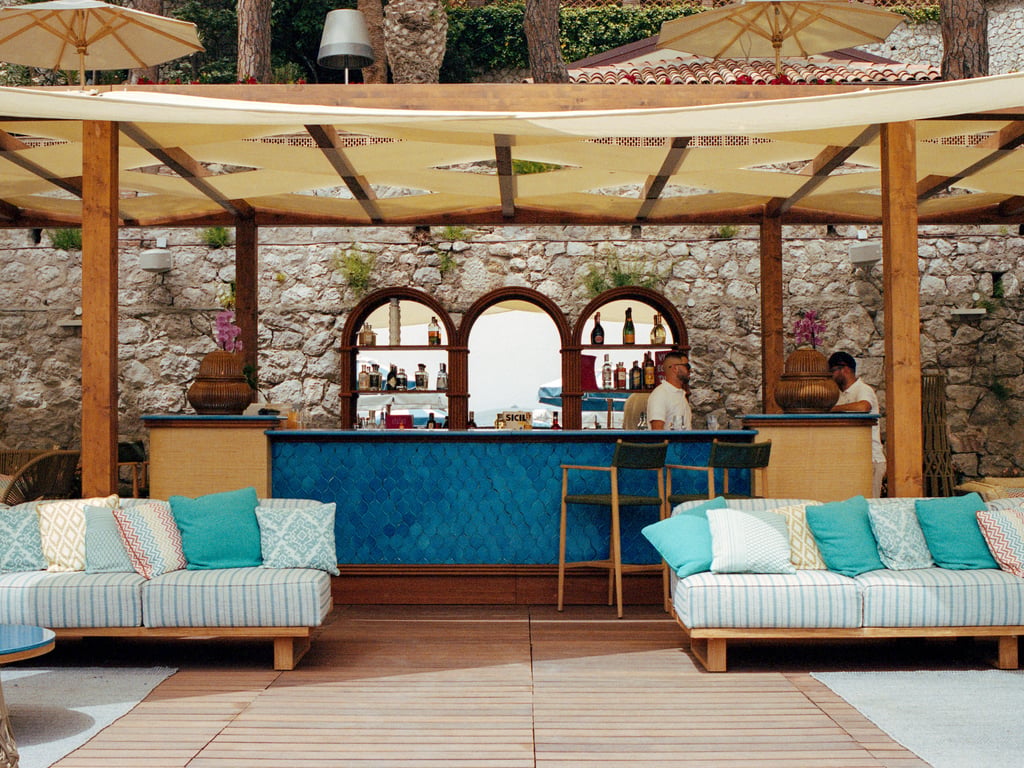 Turquoise bar and cushioned seating at Villa Sant’Andrea