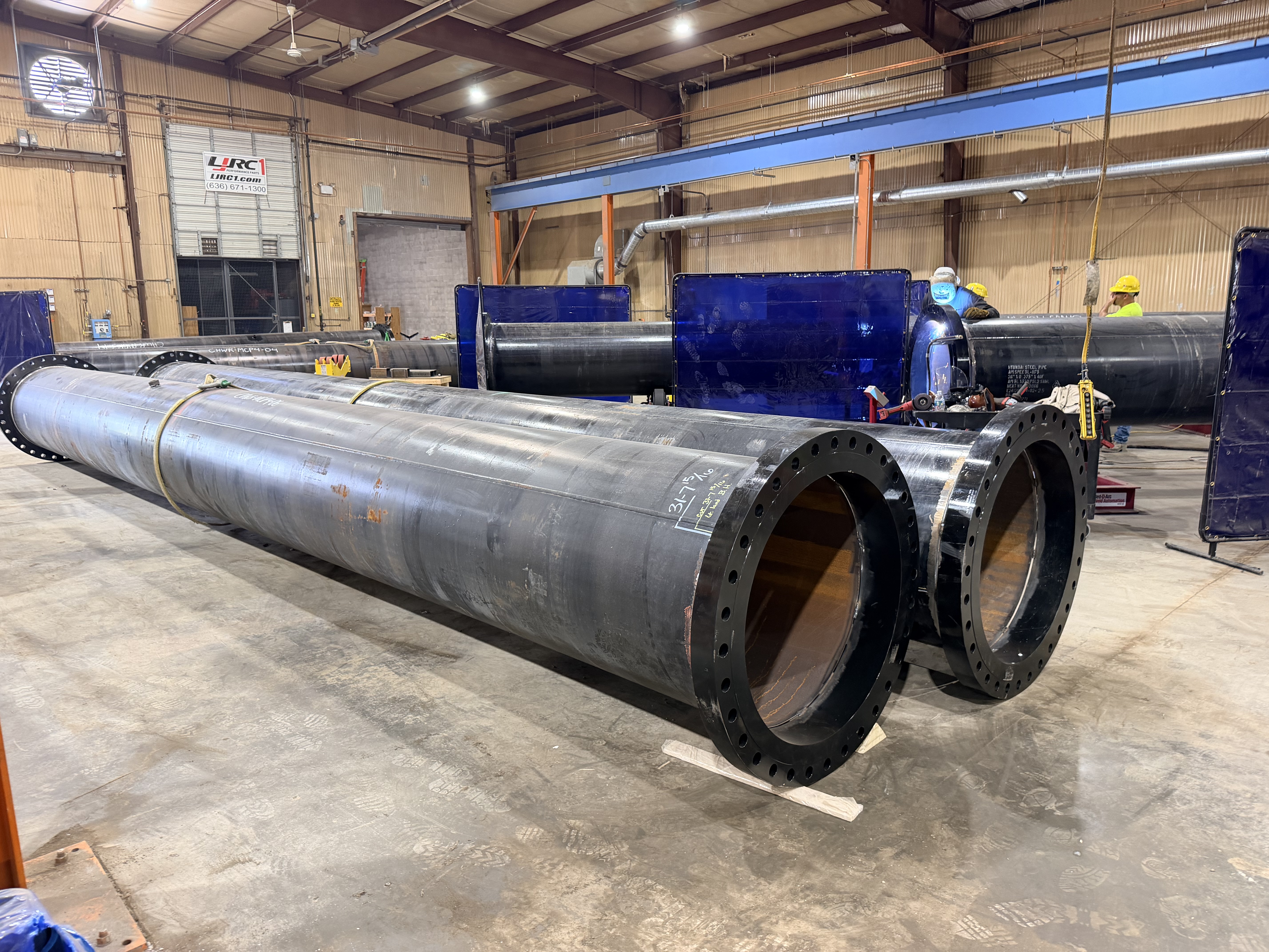 Large fabricated pipes inside the Icon Mechanical Cedar Hill shop
