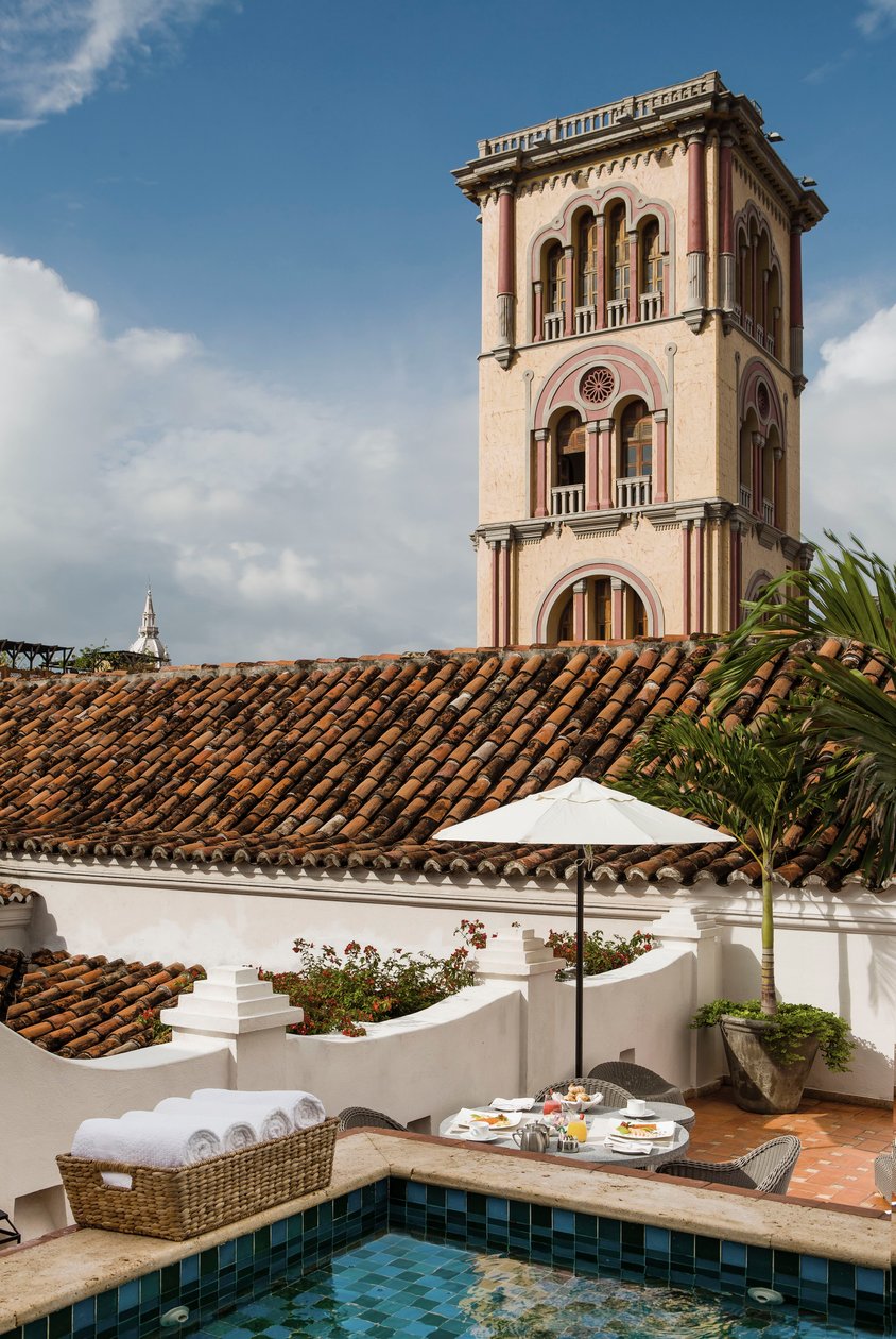 Rooftop terrace and a historic tower beside Casa San Agustín