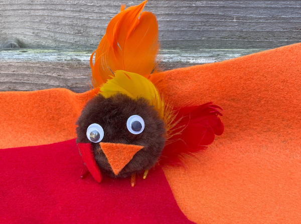 A colorful pom-pom turkey craft from the Festive Fall Science event page