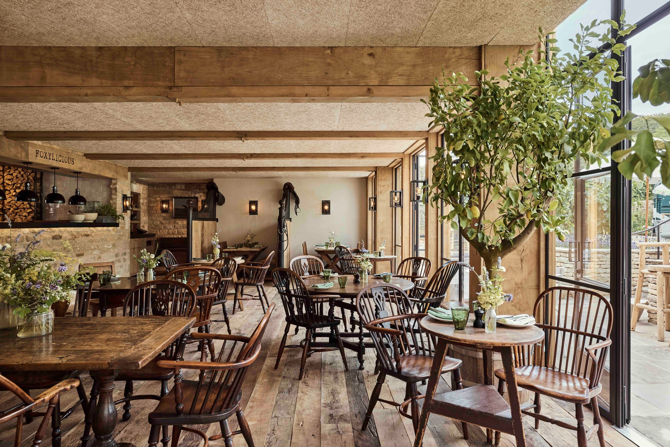 Rustic dining room opening onto the garden at The Fox at Oddington