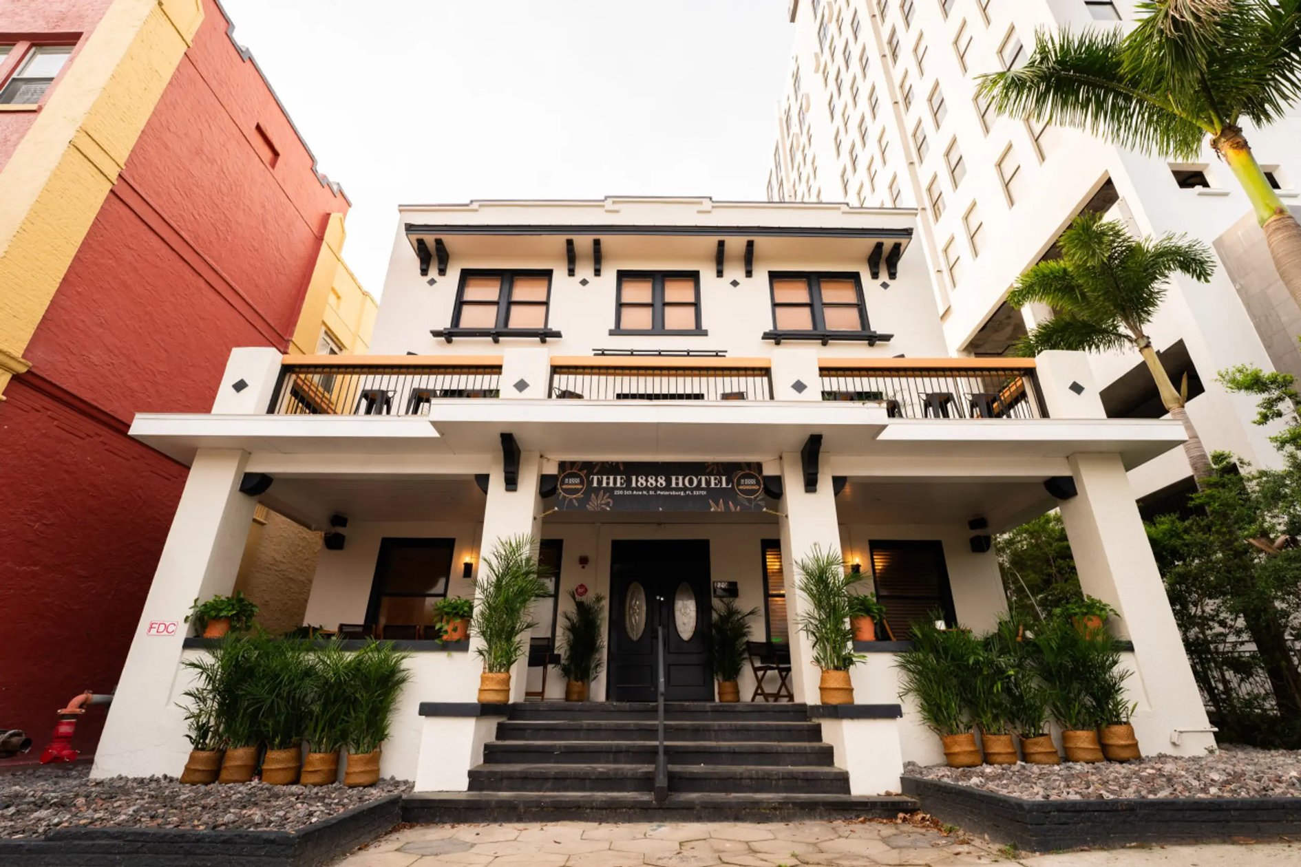 Front porch and historic facade of The 1888 Hotel in St. Petersburg