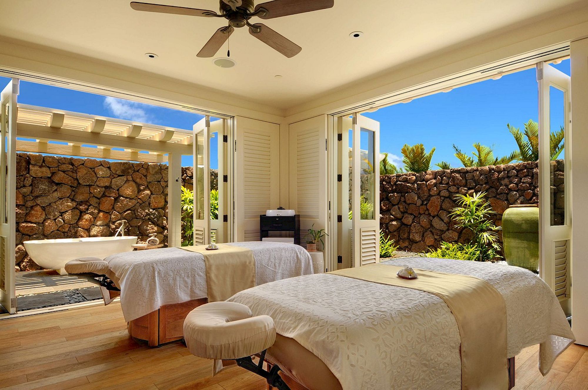 Massage room opening to a private garden
