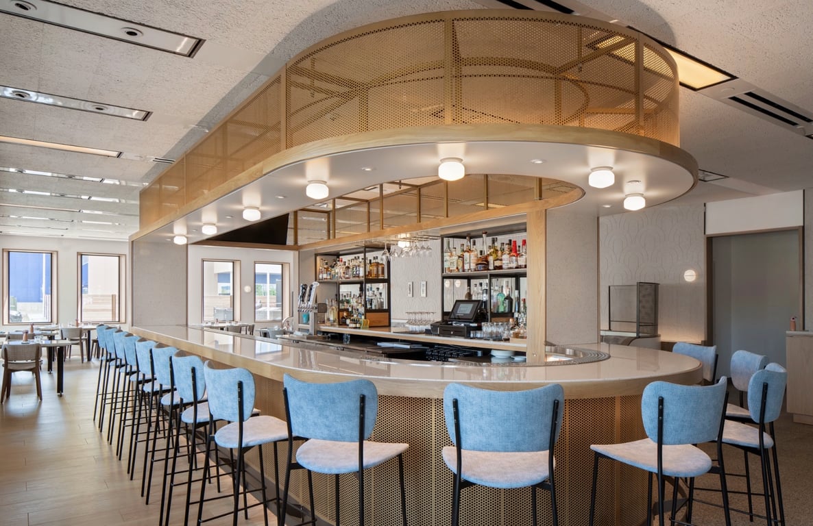 Circular bar with pale blue stools at Hotel Marcel