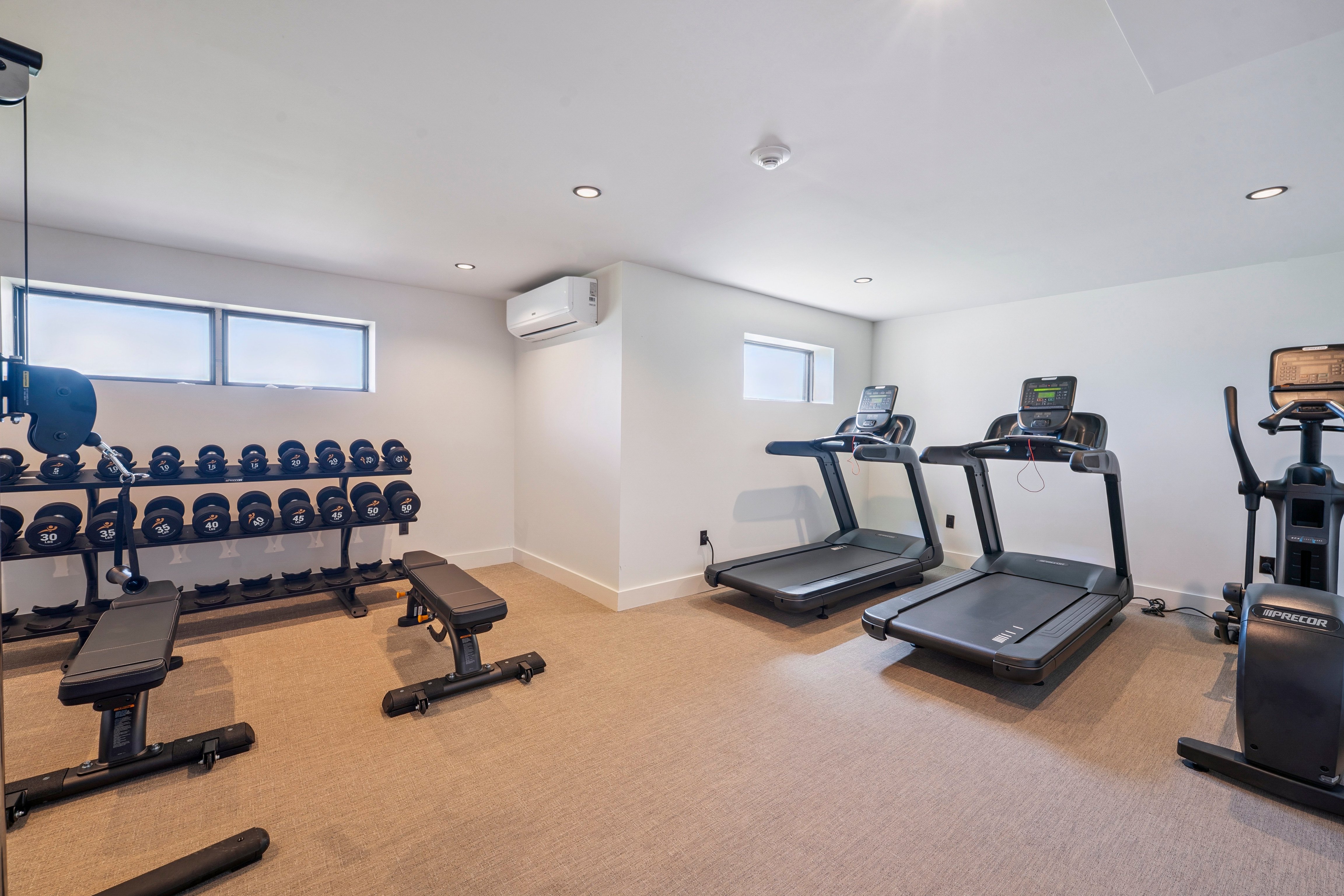 Fitness room with treadmills and weights at Offshore Montauk