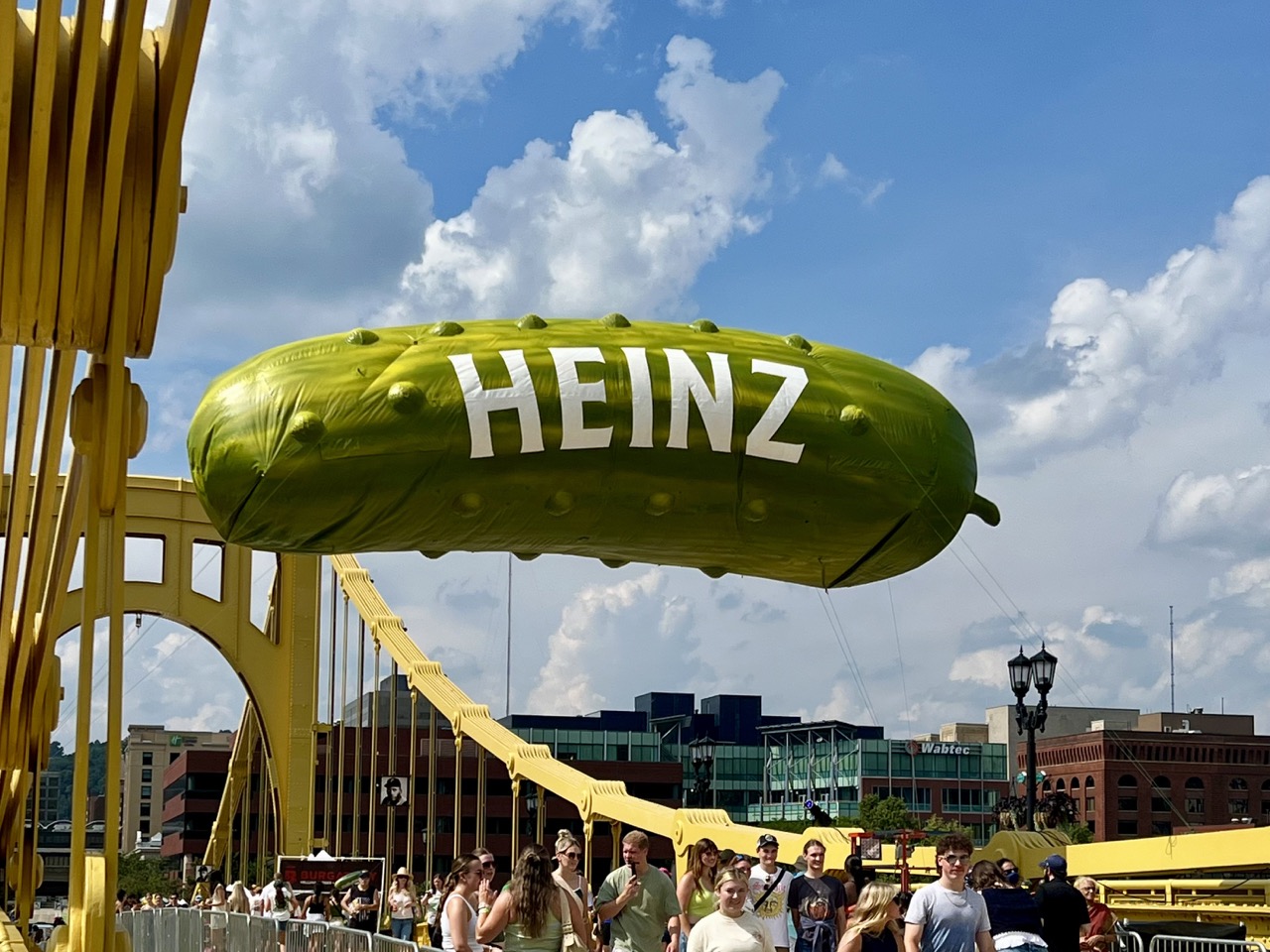 Picklesburgh balloon over a Pittsburgh bridge