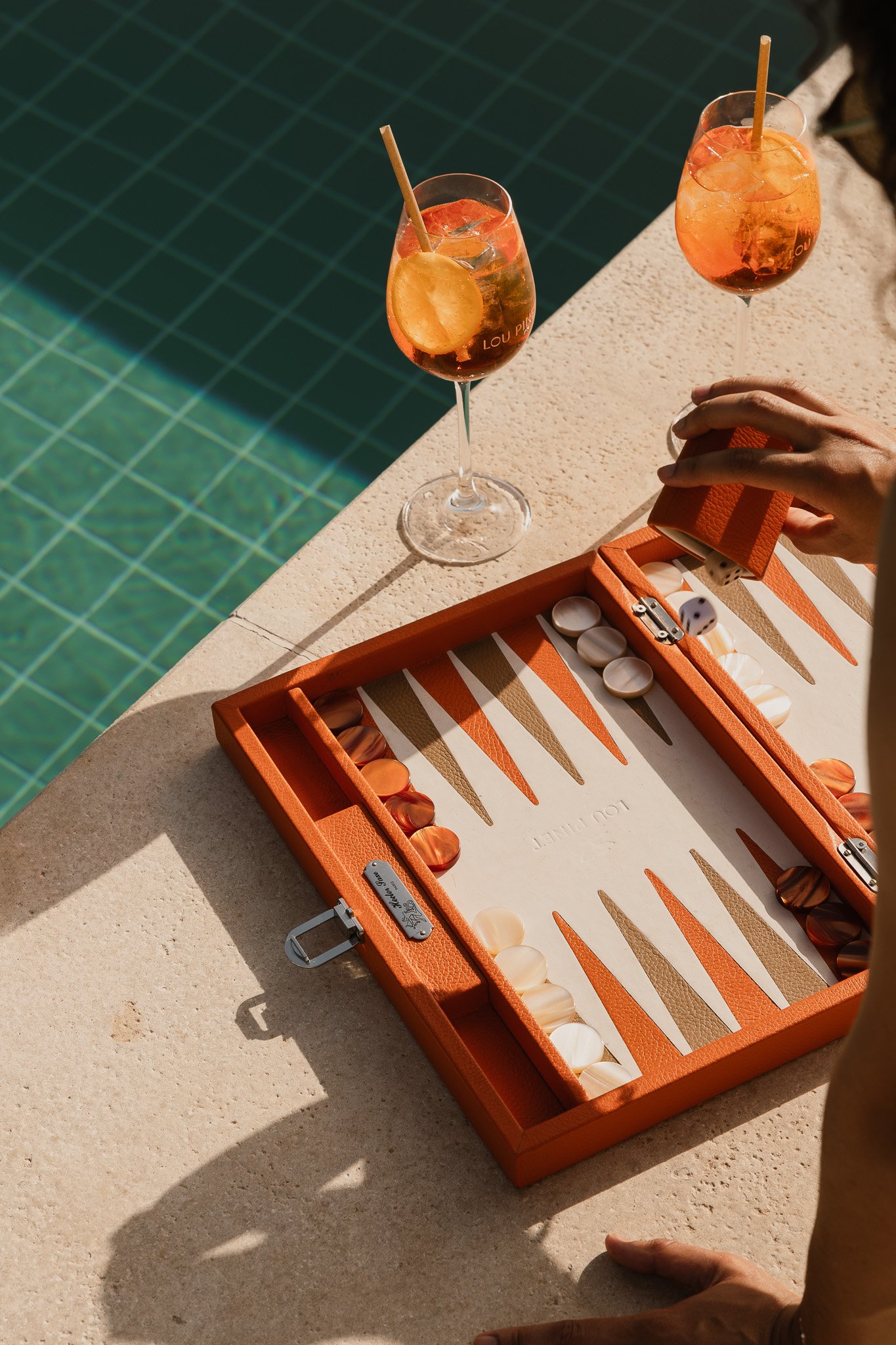 Backgammon and cocktails beside Hôtel Lou Pinet’s pool