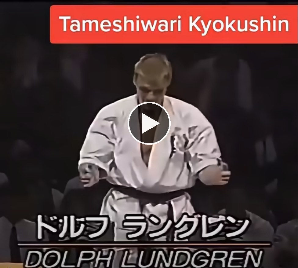 Dolph Lundgren in a karate gi stepping up for a Kyokushin board-breaking demonstration (play video)