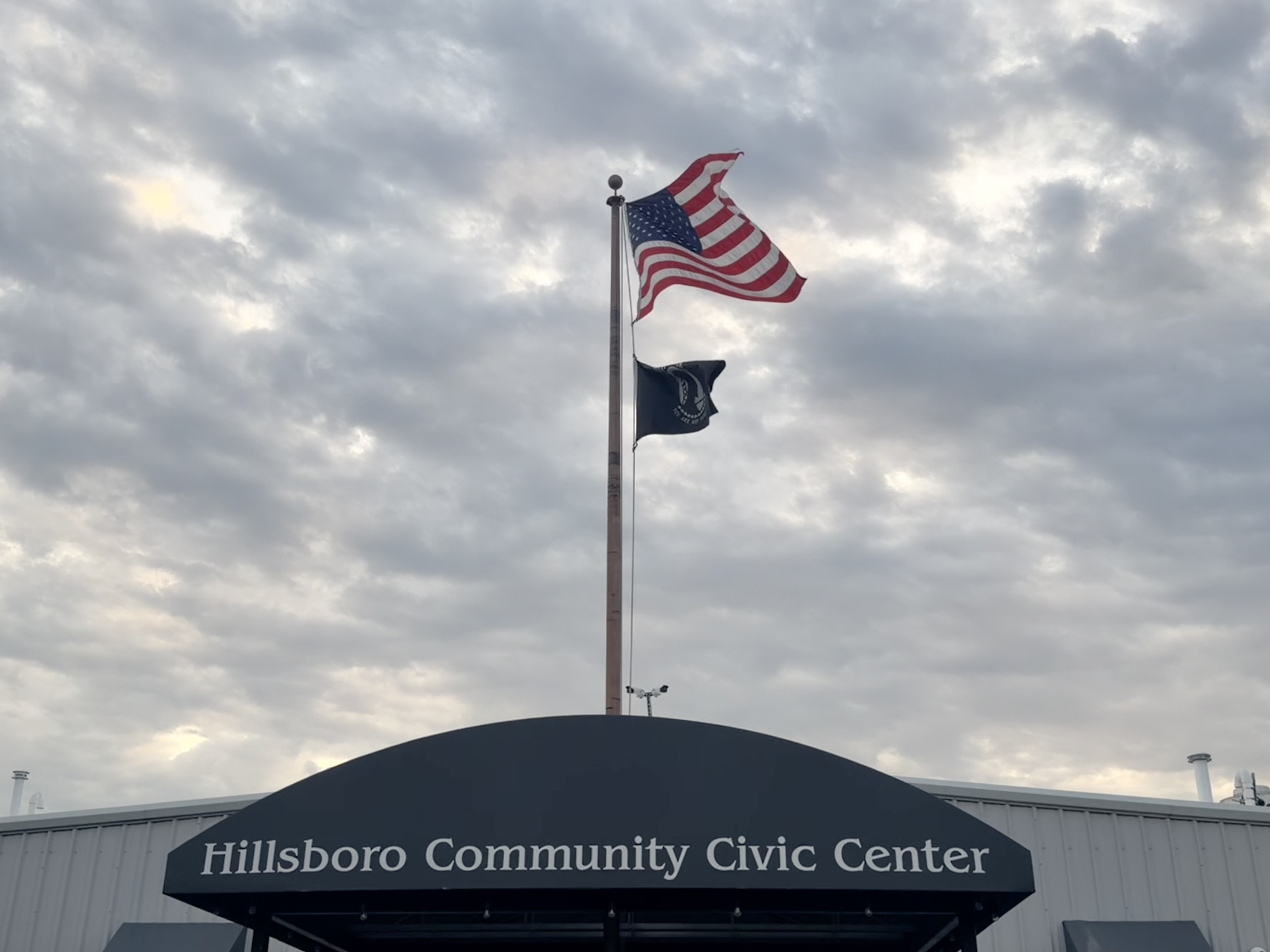 Hillsboro Community Civic Center sign with American flag