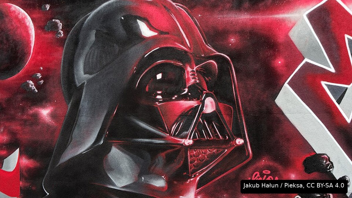 A graffiti mural of Darth Vader’s helmet in deep red tones