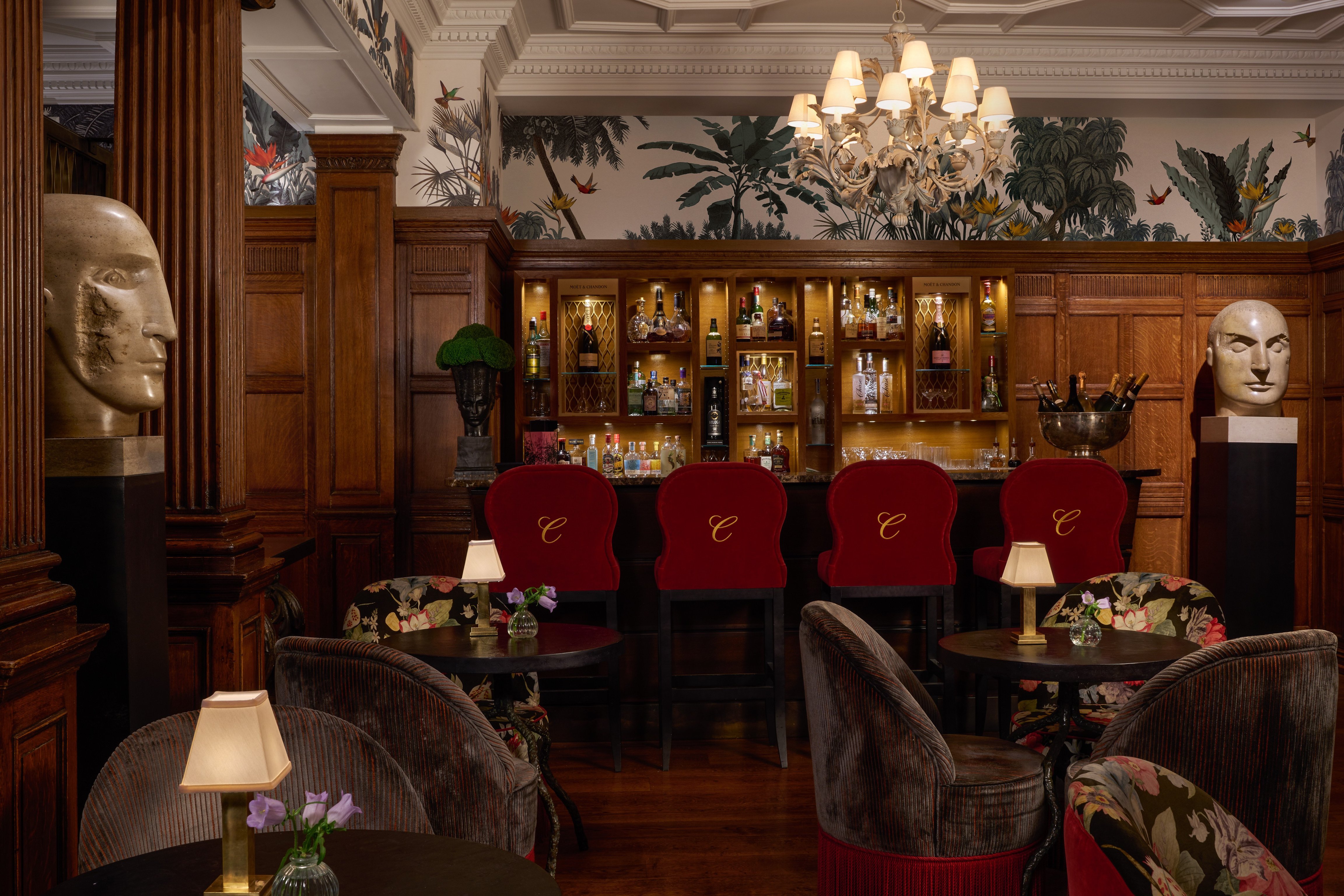Ornate bar and red seating at Brown’s Hotel