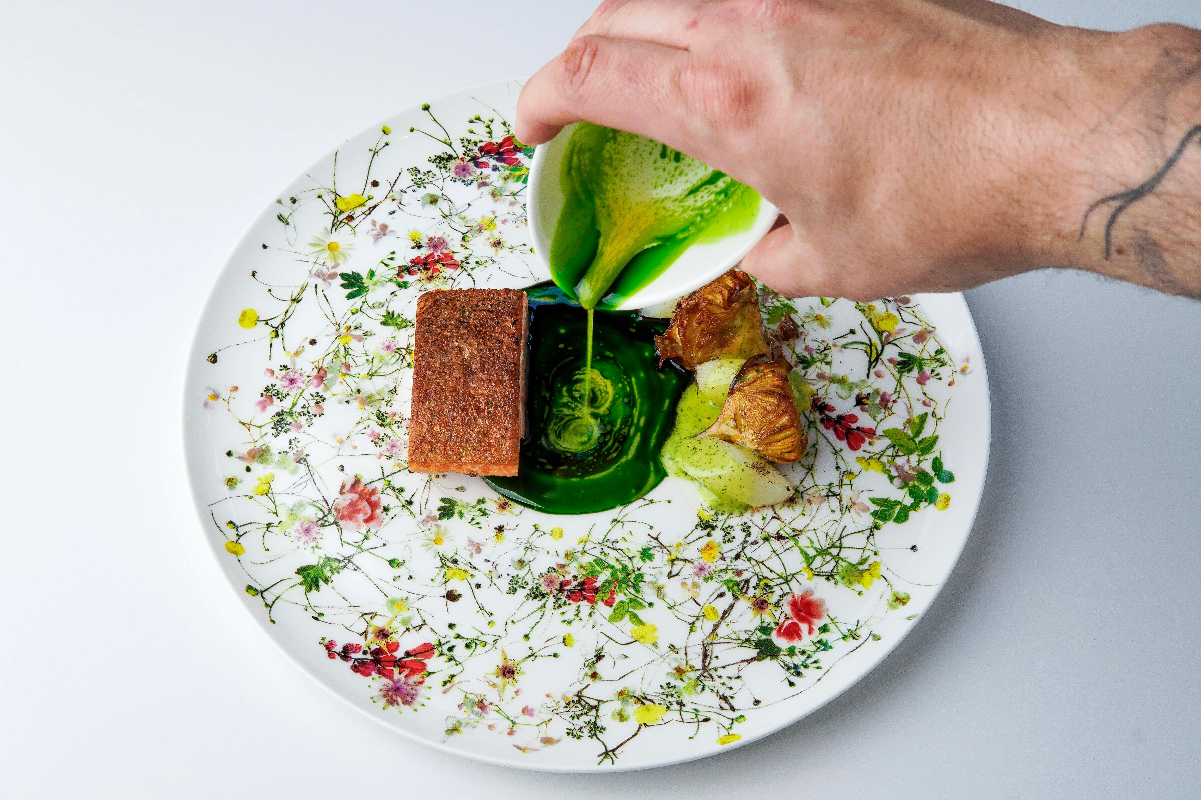 Chef finishing a dish at Farmhouse Inn