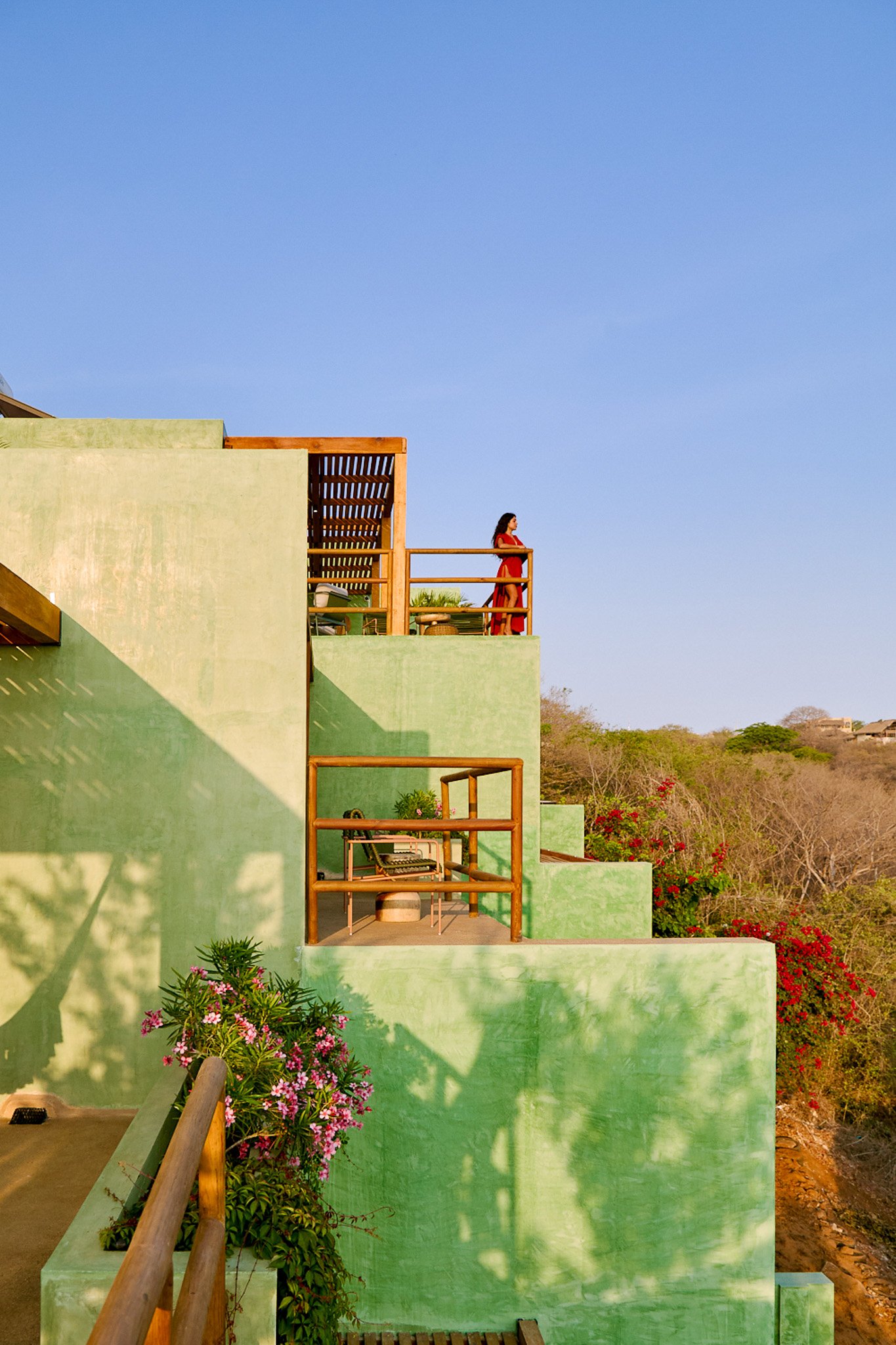 Mint-green exterior and terraces at Punta Nayaá in Puerto Escondido