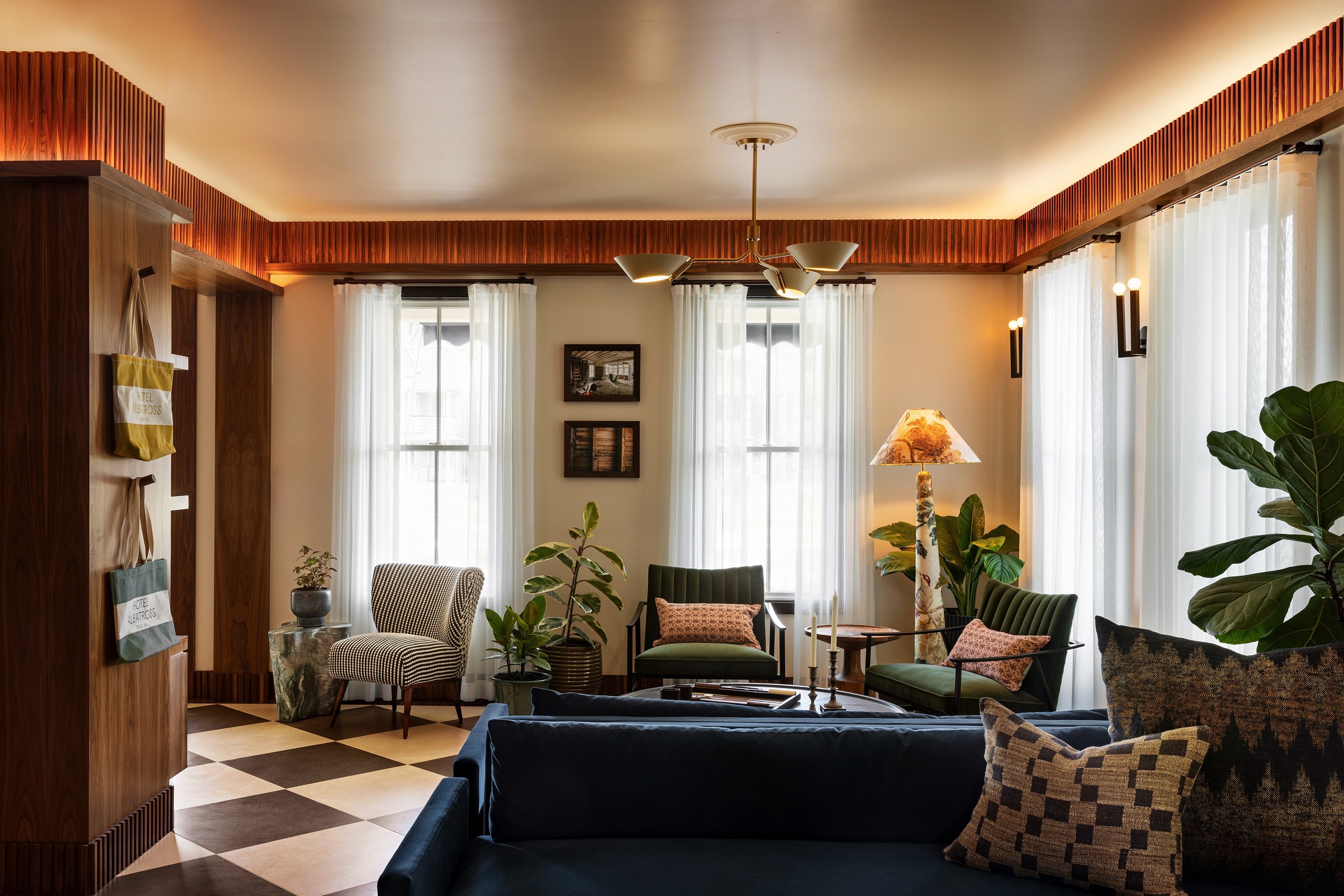Warm wood-paneled lobby lounge at Hotel Albatross in Ocean Grove