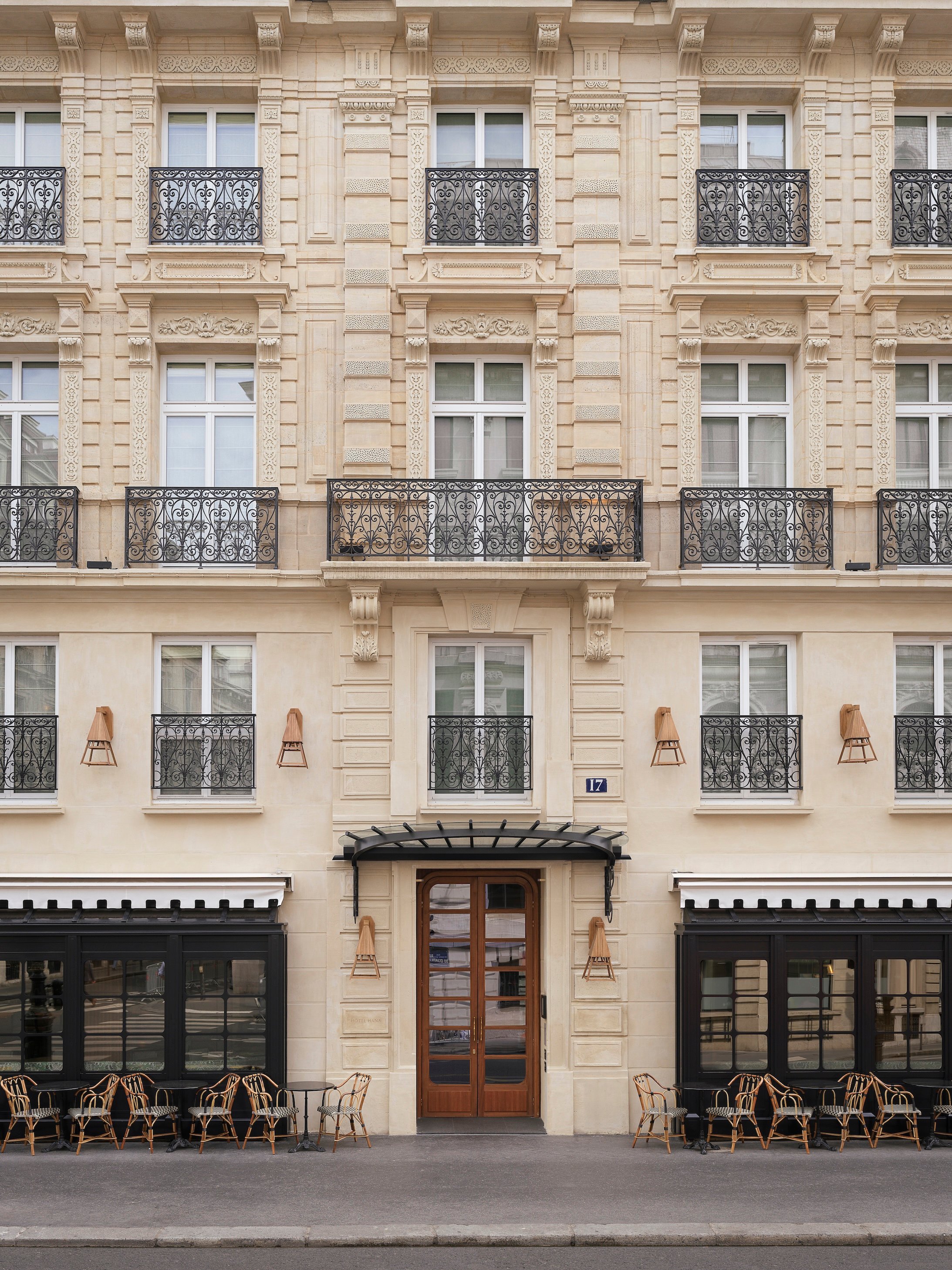 Haussmannian facade and entrance of Hotel Hana in Paris