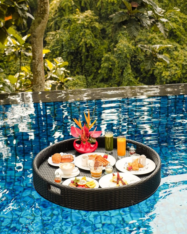 Floating breakfast tray in a private pool at Viceroy Bali