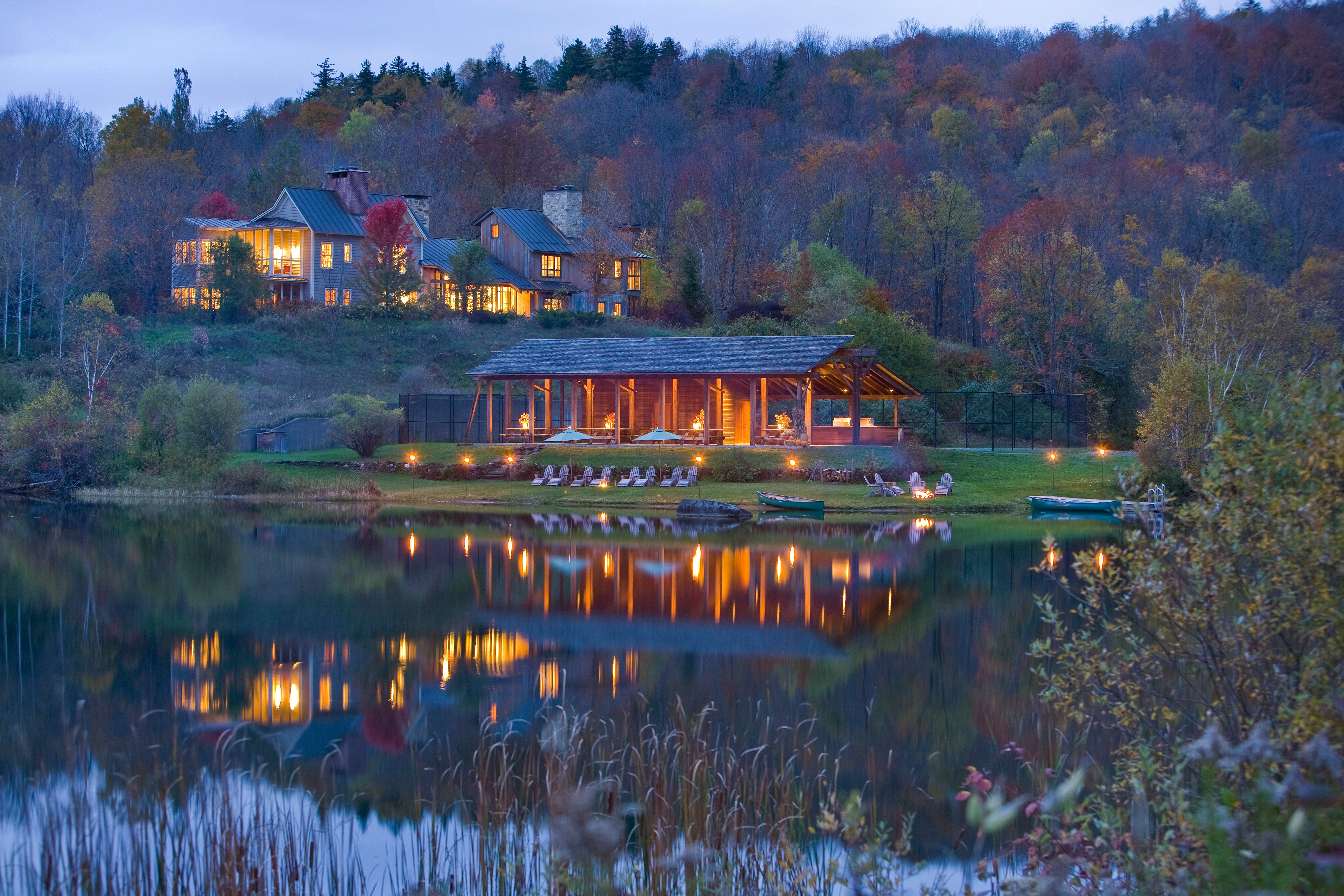 Twin Farms reflected in the pond amid autumn foliage