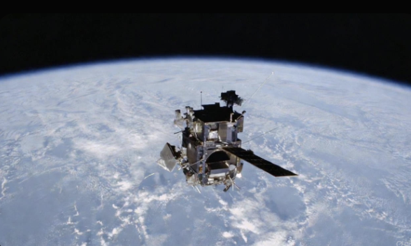 A classic Earth-observing satellite over the curve of the planet