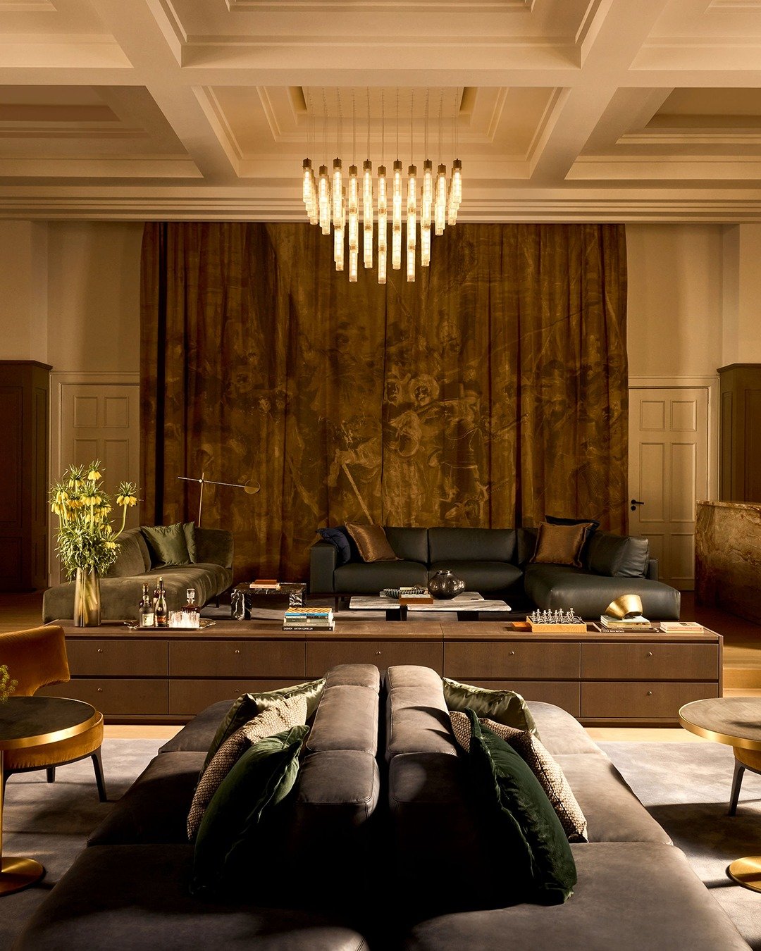 Grand lounge with a chandelier and layered seating