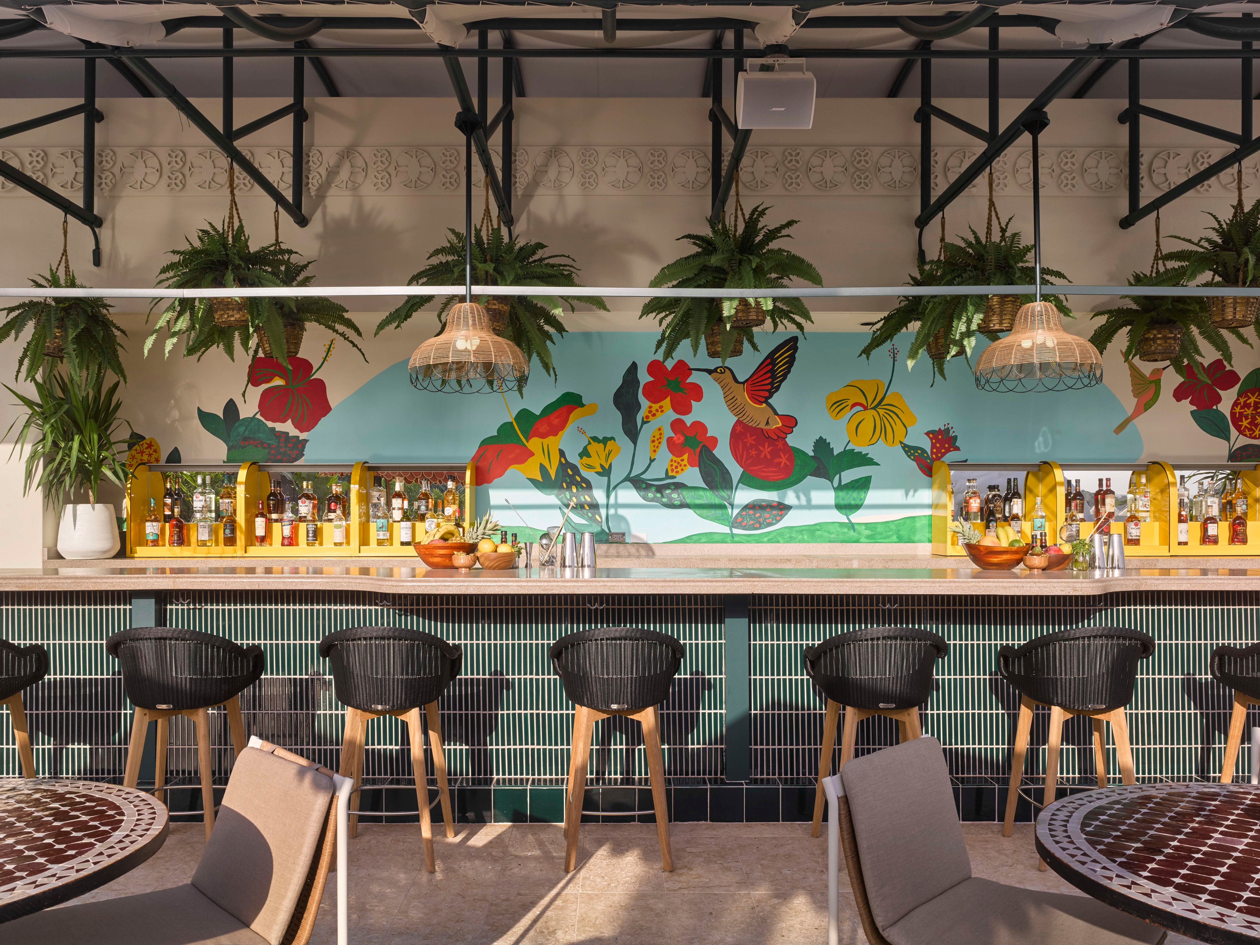 Tropical mural behind the rooftop bar at Mayfair House Hotel and Garden