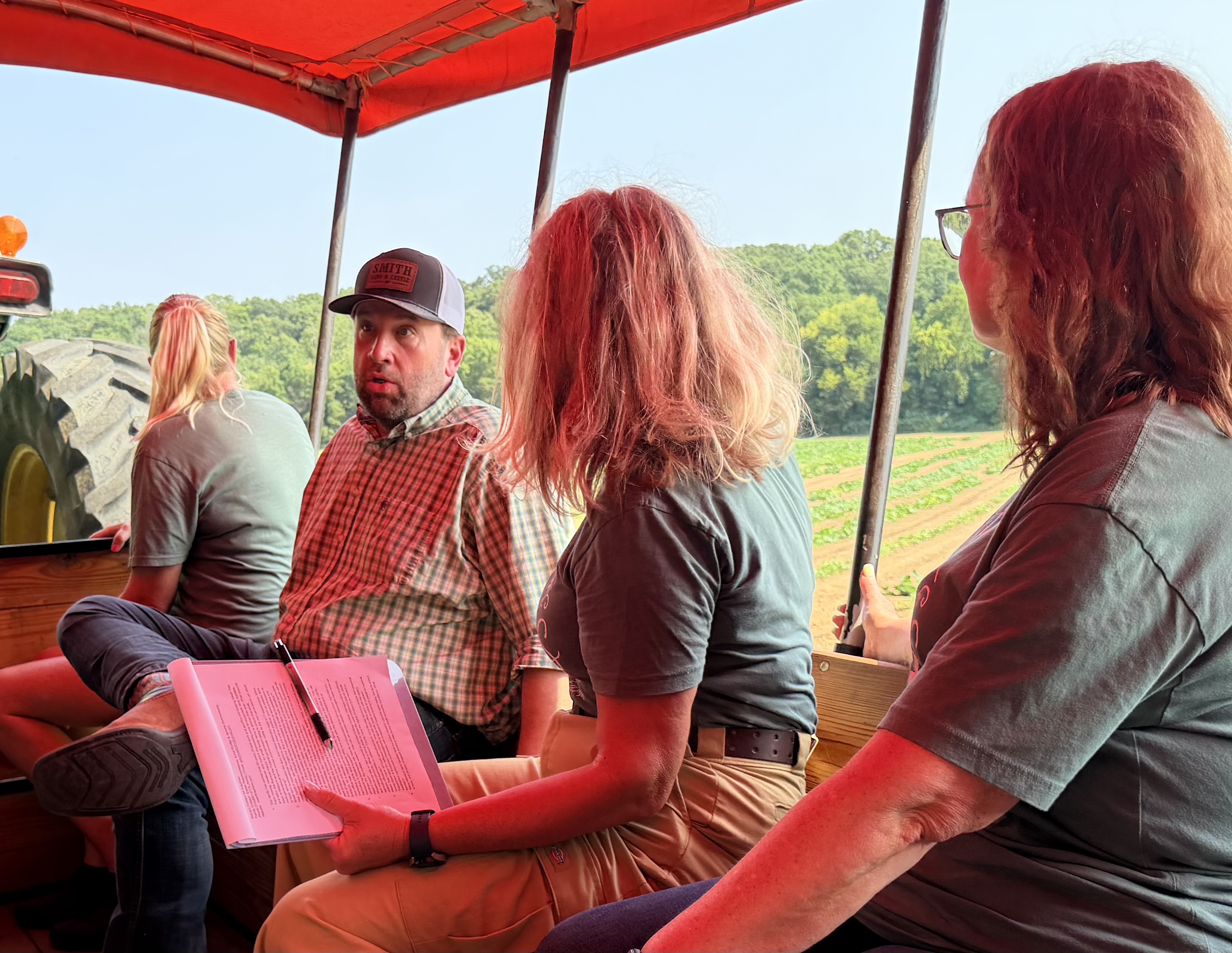 Congressman Jason Smith speaking with members of the Meert Tree Farm family during a wagon tour