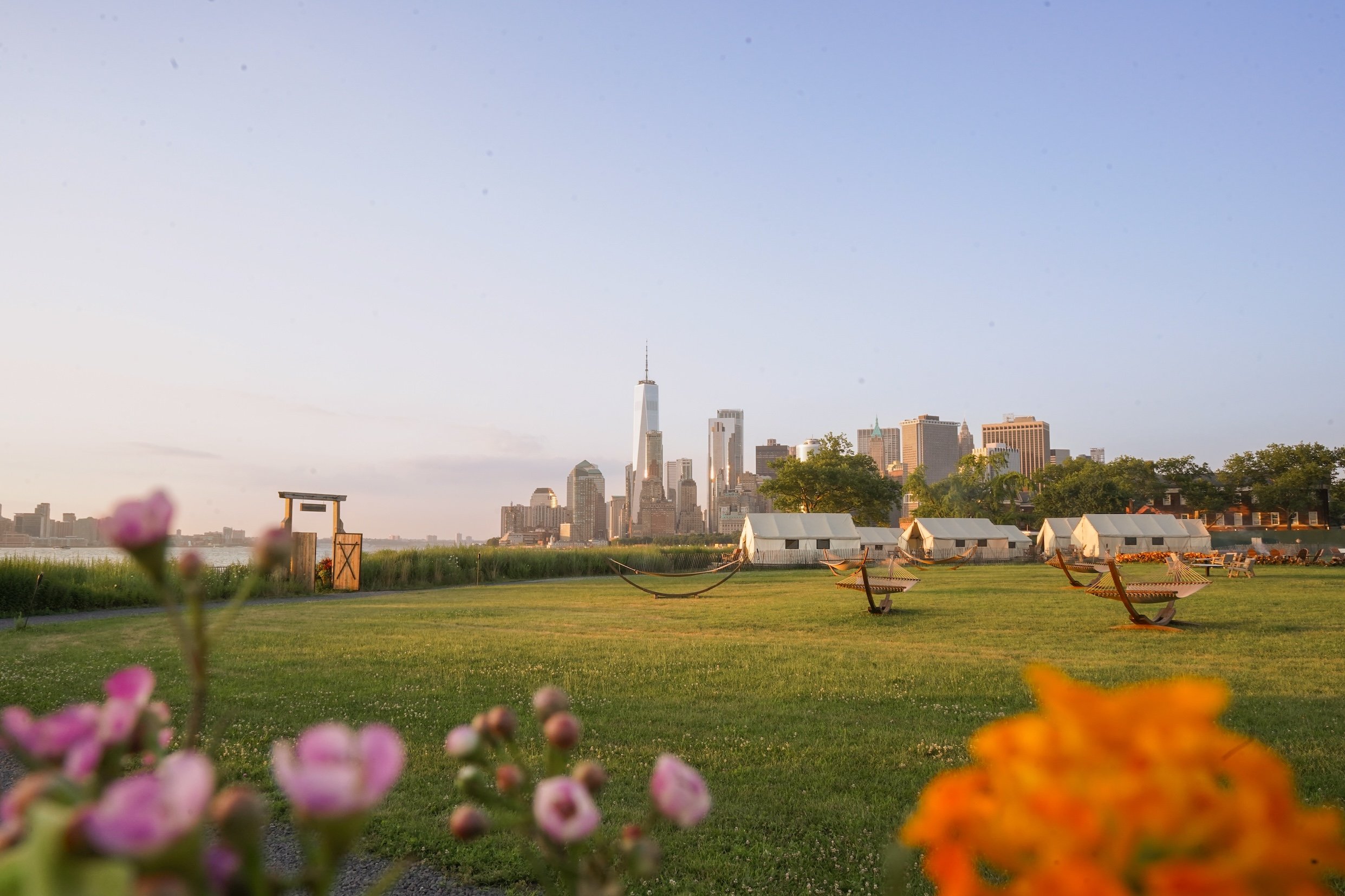 Lawn and Manhattan skyline at Collective Retreats Governors Island