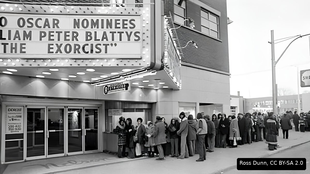 Crowds lining up outside a cinema showing The Exorcist in the 1970s
