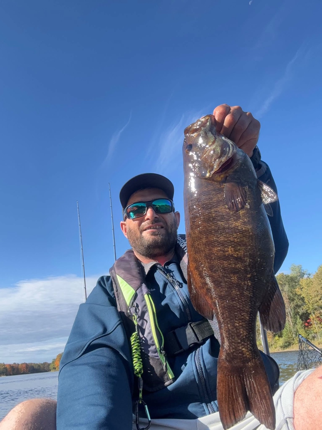 Addicted Angler holding a big smallmouth bass from his kayak