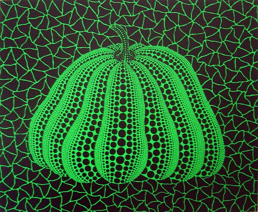 A green polka-dot pumpkin painted against a black and green webbed background