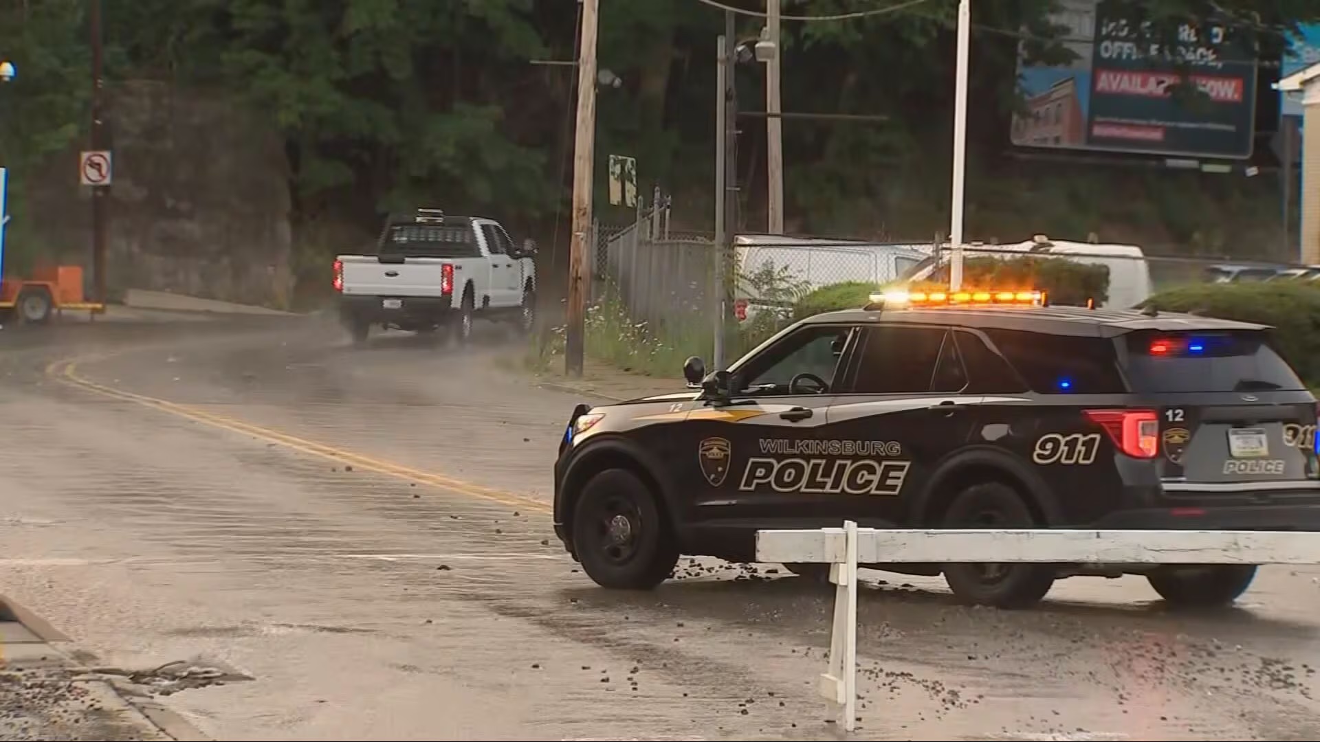 A flooded, closed Pittsburgh side street