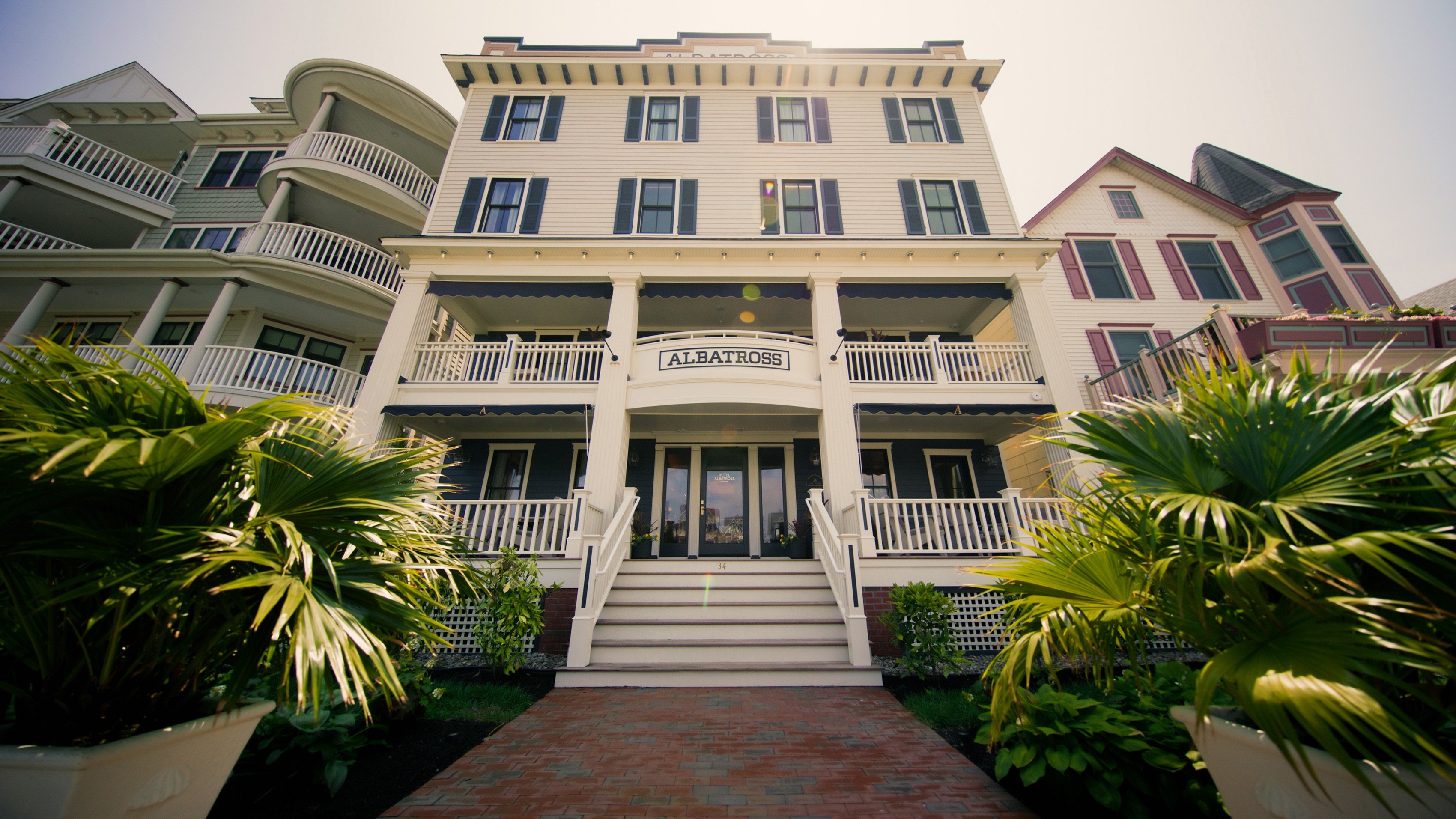 Victorian facade and front porch of Hotel Albatross in Ocean Grove