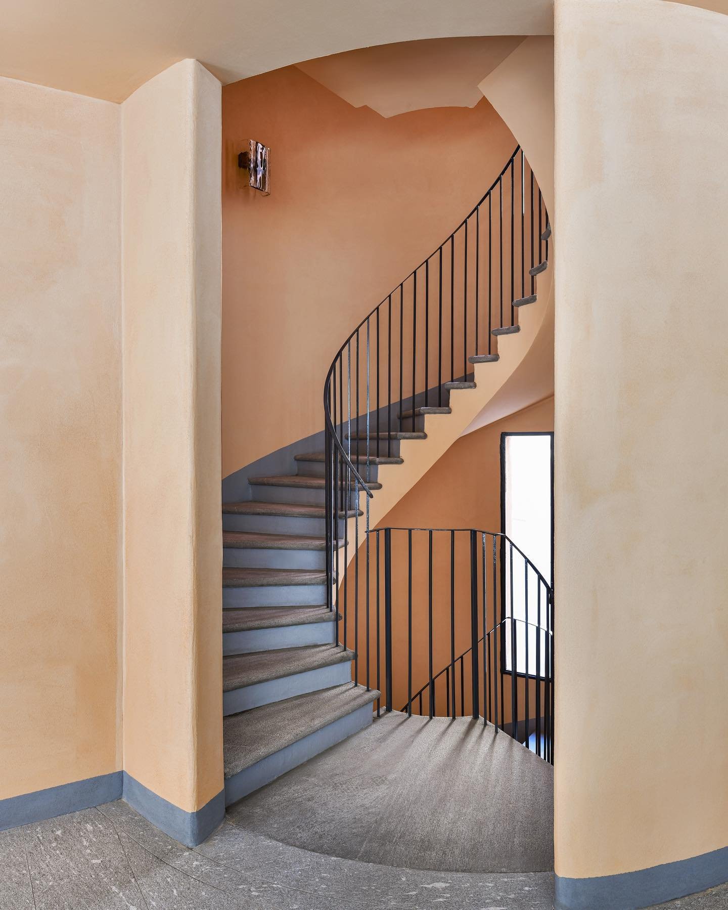 Curving staircase inside Casa Brivio