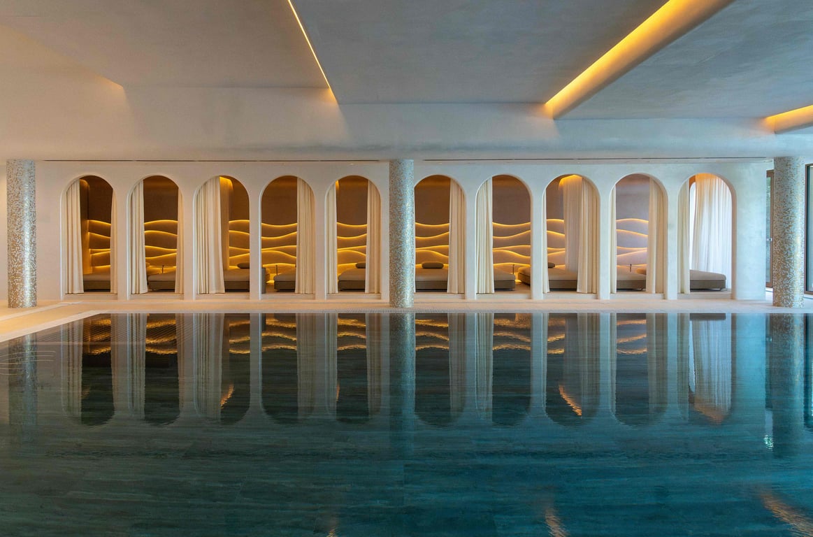 Indoor pool lined with archways at Castelfalfi