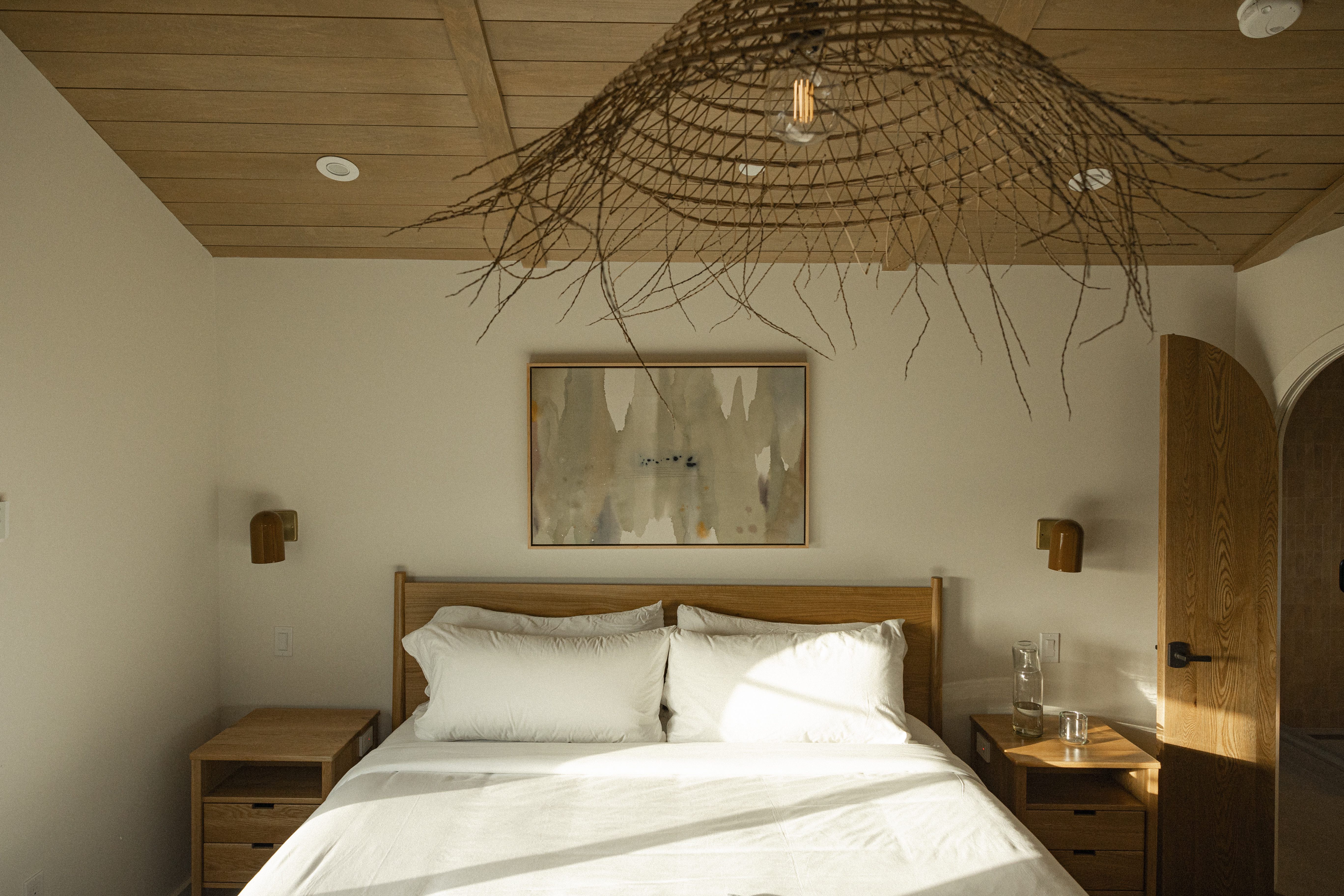 A coastal-modern guest room at Woods Cove Inn