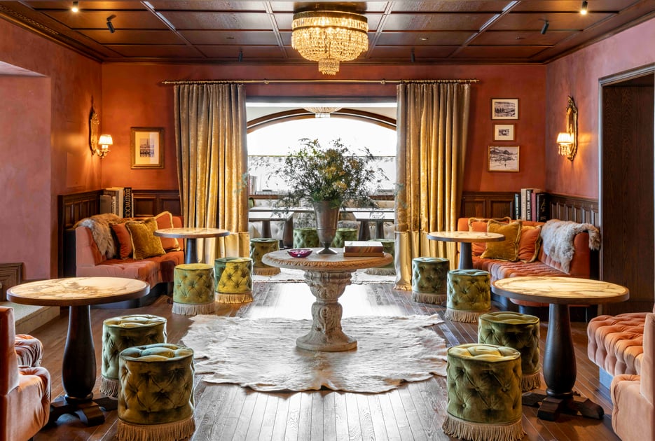 Wood-paneled lounge with colorful seating