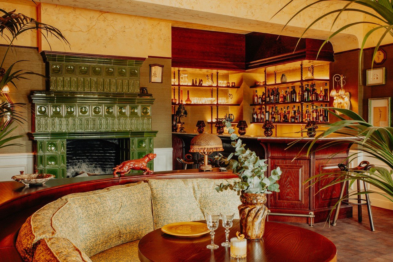 Colorful bar with green tiles and curved seating