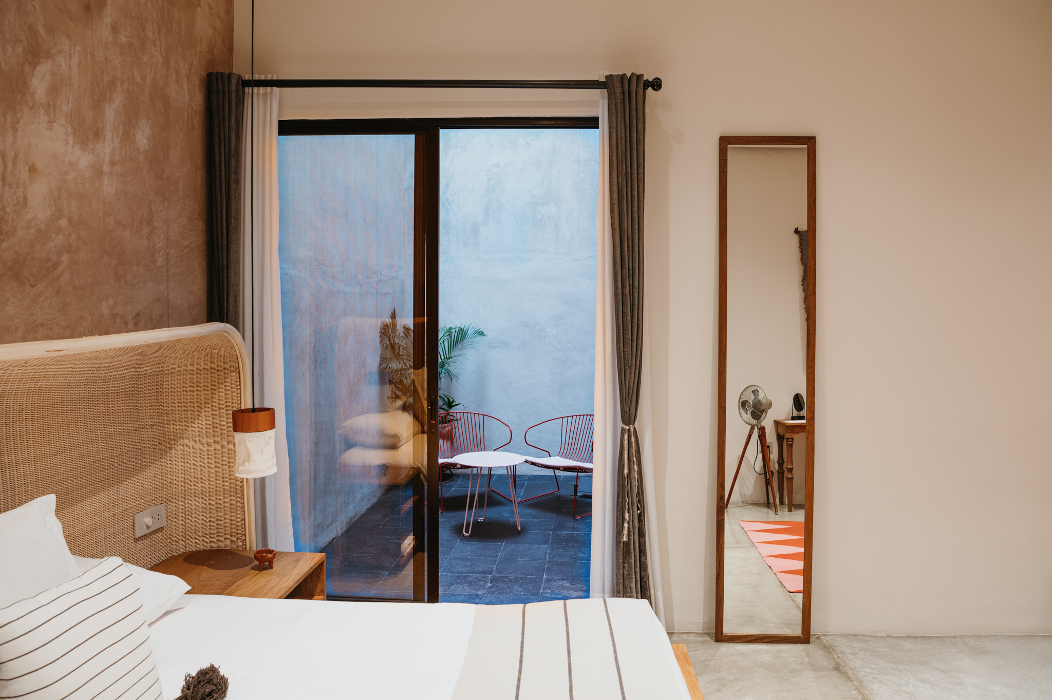 A warm, minimalist guest room at Casa Antonieta